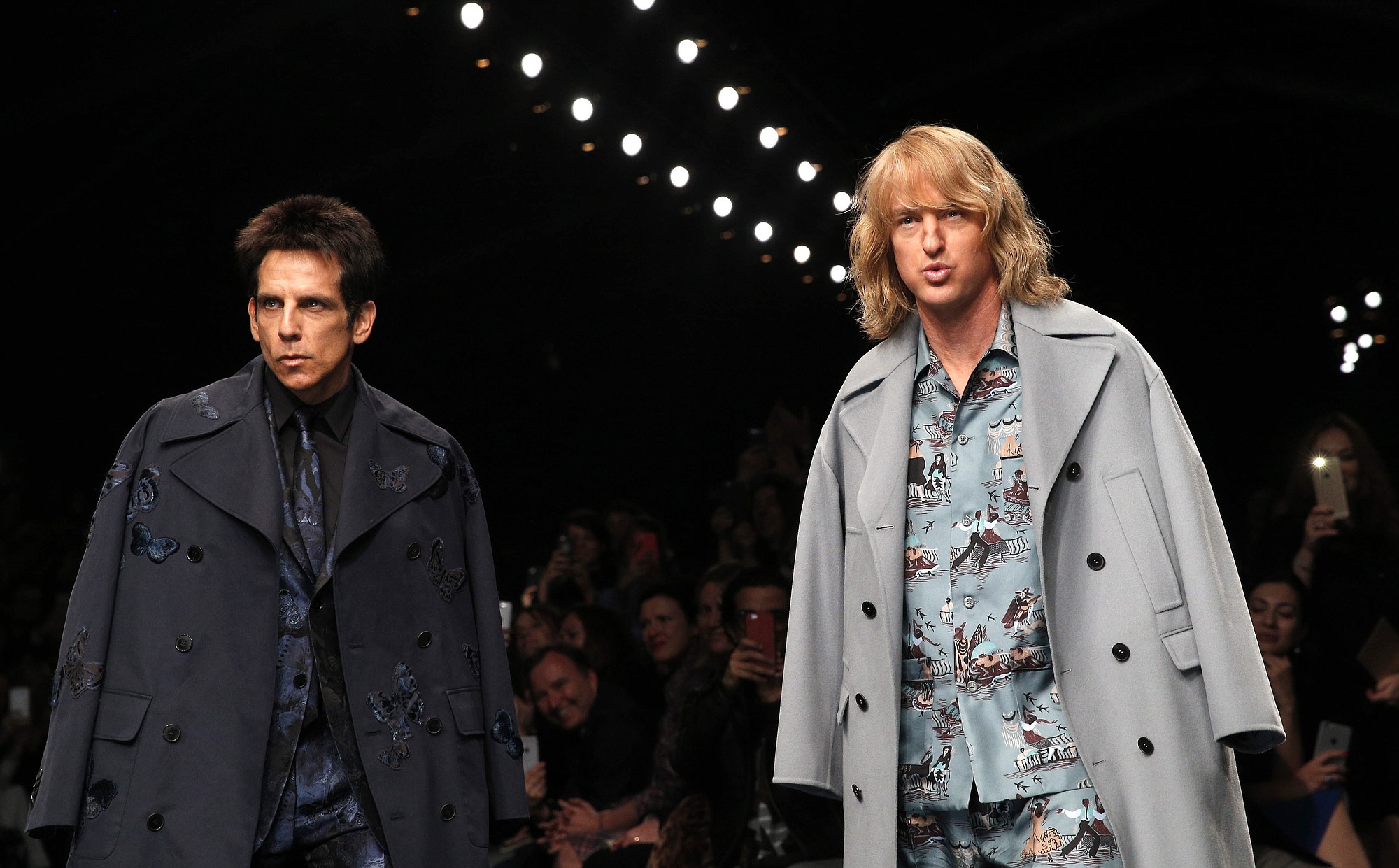 Actors Ben Stiller, left, and Owen Wilson wear creations for Valentino's fall-winter 2015-16 ready to wear fashion collection on Tuesday at Paris fashion week.