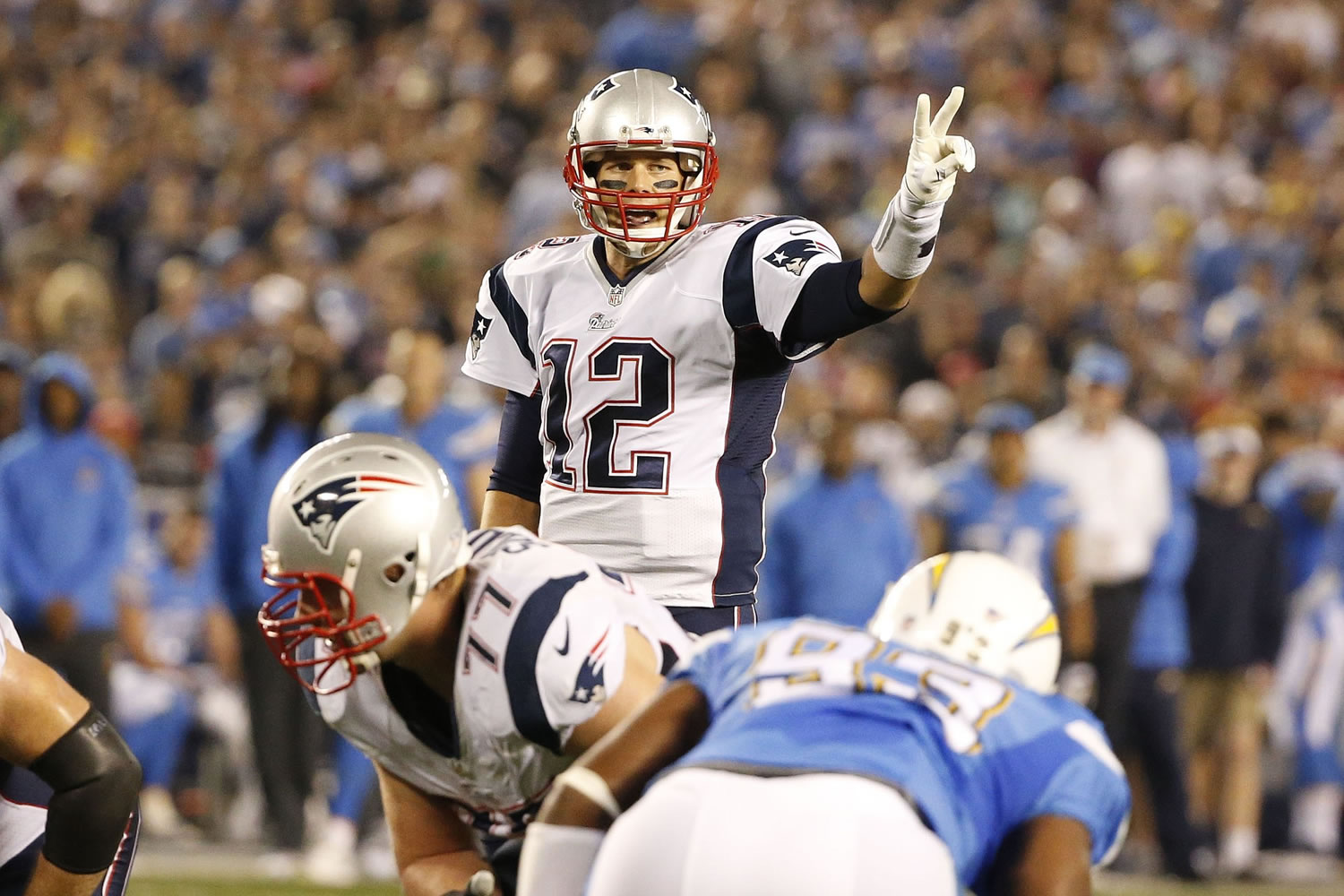 New England Patriots quarterback Tom Brady motions while playing the San Diego Chargers during the first half Sunday, Dec. 7, 2014, in San Diego.