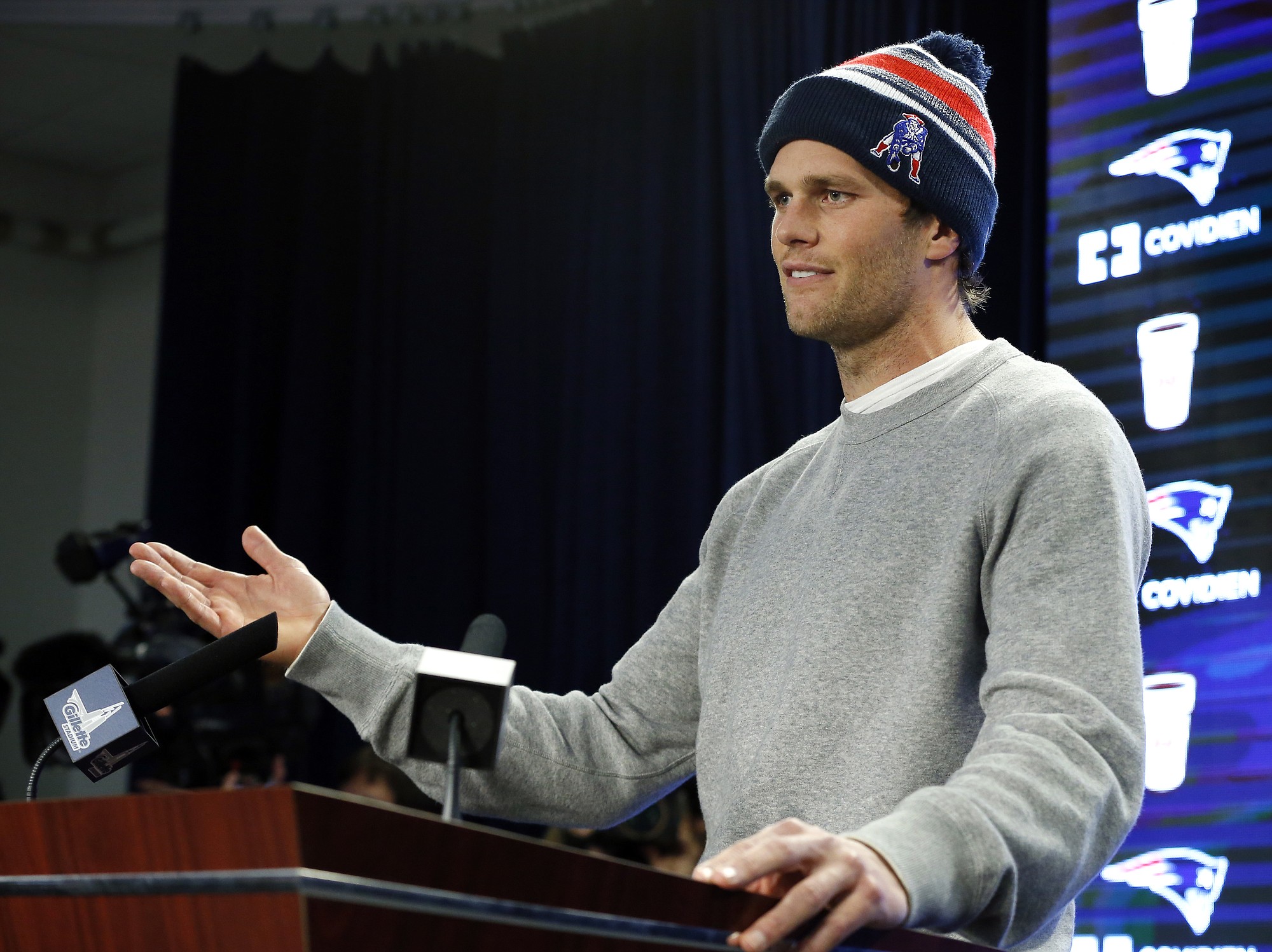 In this Jan. 22, 2015, file photo, New England Patriots quarterback Tom Brady speaks at a news conference about the NFL investigation into deflated footballs, in Foxborough, Mass. An NFL investigation has found that New England Patriots employees likely deflated footballs and that quarterback Tom Brady was &quot;at least generally aware&quot; of the rules violations.