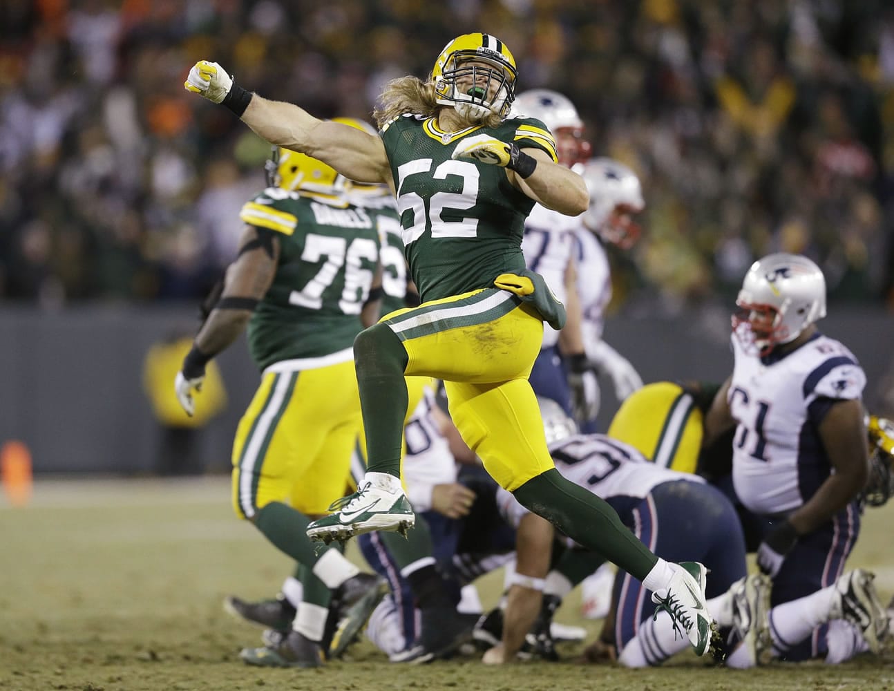 Green Bay Packers' Clay Matthews celebrates after the New England Patriots missed a field goal attempt during the fourth quarter Sunday, Nov. 30, 2014, in Green Bay, Wis.