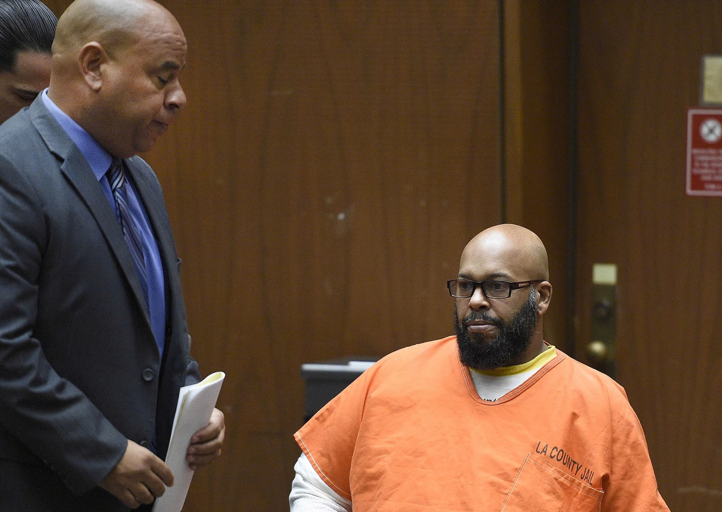 Marion &quot;Suge&quot; Knight, right, appears March 9 with his attorney Matthew Fletcher in court for a hearing about evidence in his murder case in Los Angeles, Calif.  Los Angeles prosecutors are asking a judge to set bail in a murder case against the former rap music mogul Knight at $25 million, citing his violent history. The motion filed by Deputy District Attorney Cynthia Barnes on Thursday cites 31 incidents in which Knight is accused of threatening others or using violence.