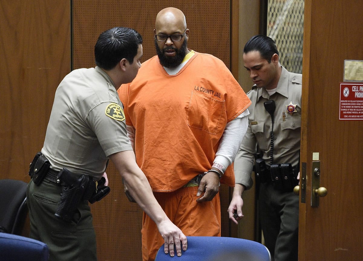 Marion &quot;Suge&quot; Knight, center, arrives in court on Monday, March 9, 2015, in Los Angeles, Calif.