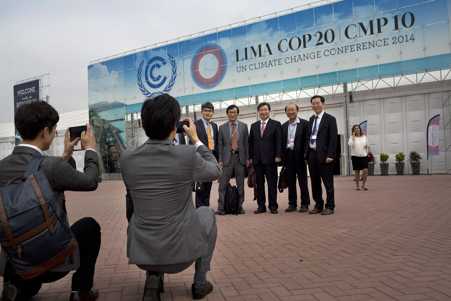 A delegation from South Korea poses for a photo as they arrive Monday for the United Nations' climate change conference in Lima, Peru.