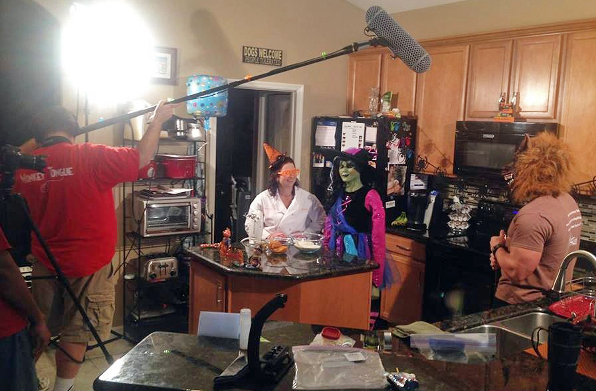 Denise Fernandez, in white smock, and crew members prepare to record a Halloween edition of the Doggy Cooking Network, a unique YouTube show for those into canine cuisine, at Kris Rotonda's home in Safety Harbor, Fla.