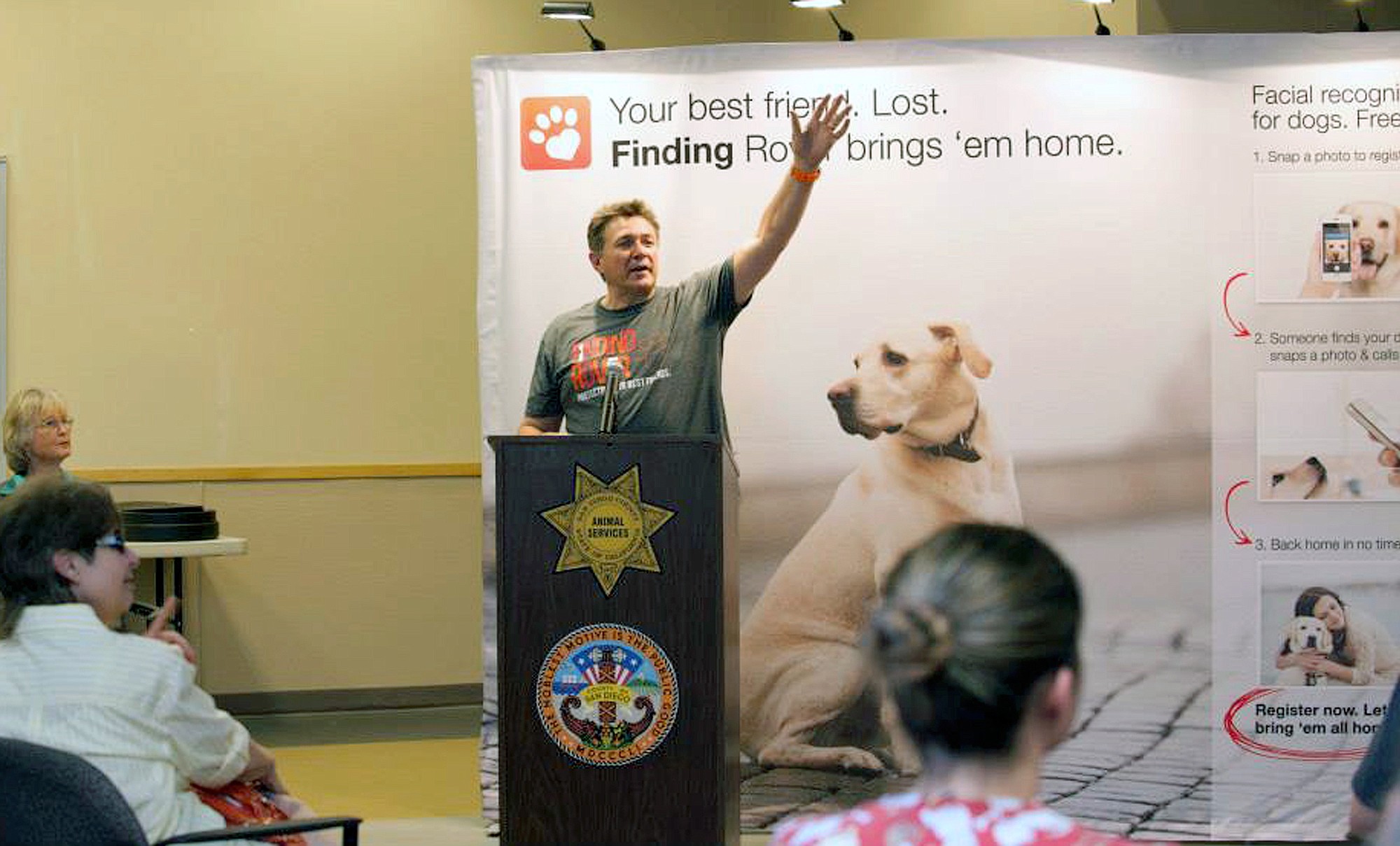 This May 16, 2014 photo provided by FindingRover.com shows founder of the smart phone application Finding Rover John Polimeno during a news conference in San Diego.  In May, San Diego County Animal Services became the first shelter system in the country to adapt the facial recognition plan.