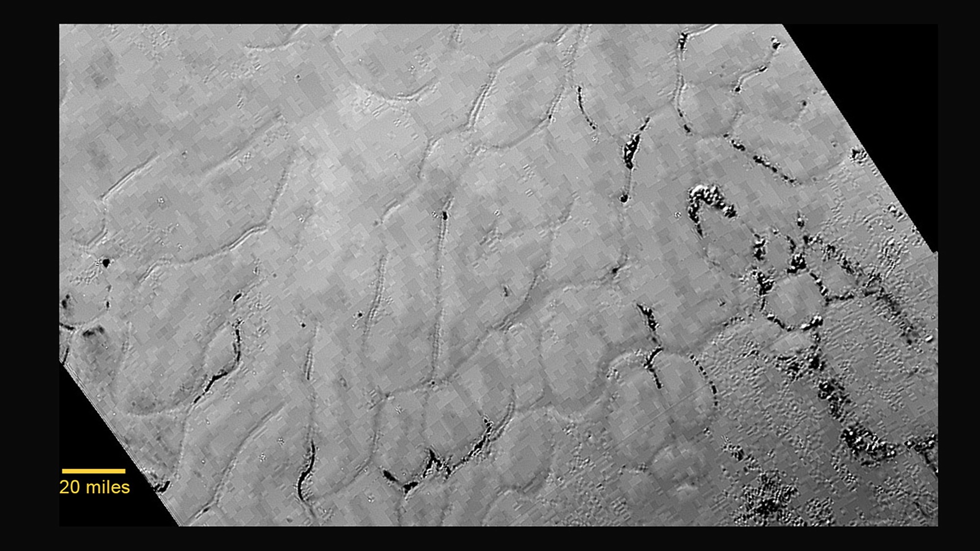 NASA
An image taken from NASA's New Horizons spacecraft shows a new close-up image from the heart-shaped feature on Pluto that reveals a vast, craterless plain.