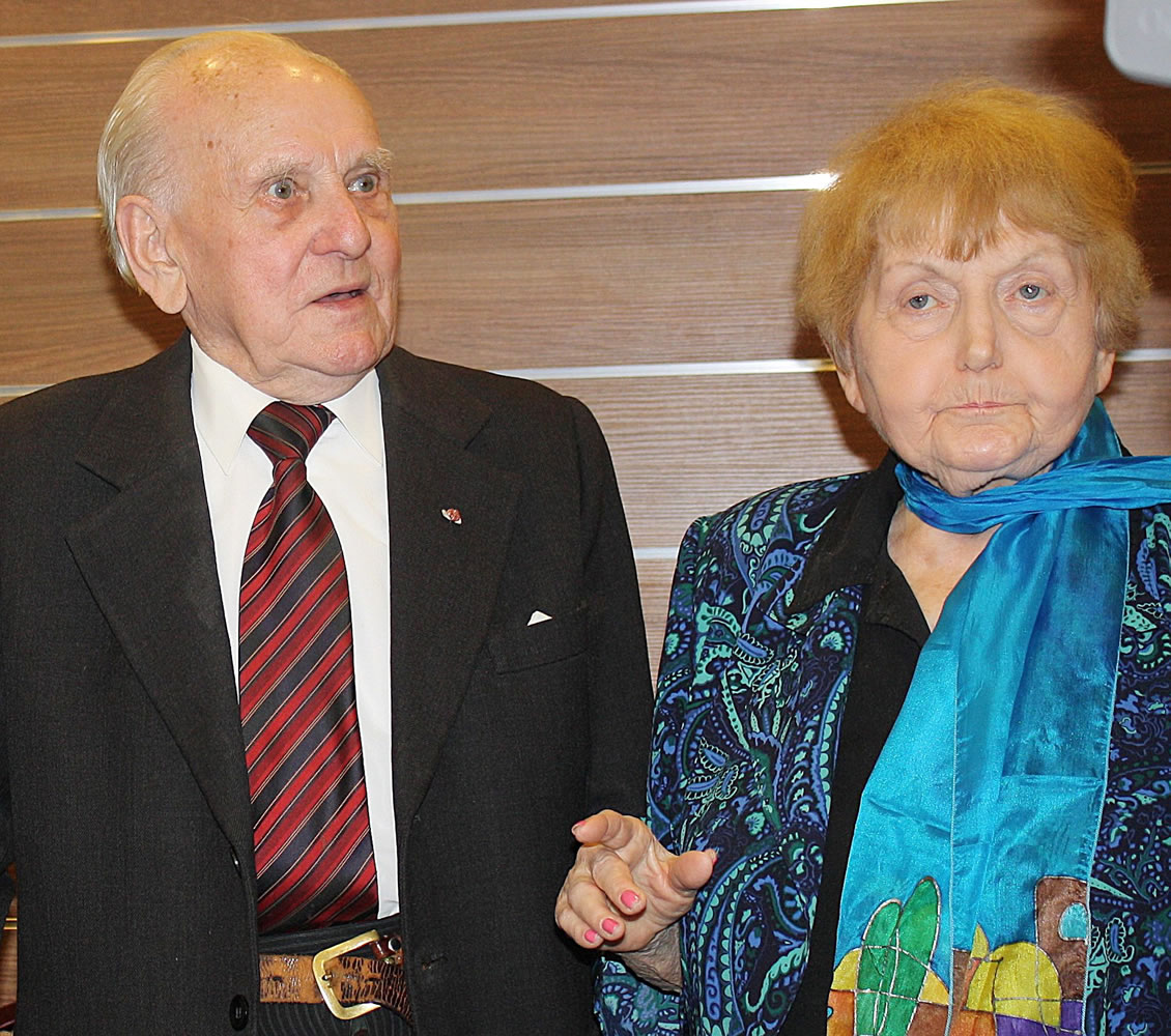 Jozef Paczynski, left, 95, a former Auschwitz prisoner who was the barber to camp commandant Rudolf Hoess, stands last month next to Eva Mozes Kor, 81, a Jewish survivor of experiments by the sadistic German doctor Josef Mengele, in Krakow, Poland.  Paczynski spoke to a group about his experiences cutting Hoess' hair for four years. He said he has been asked over and over why he didn't use his sharp instruments to slit the throat of the mass murderer. &quot;I thought about it,&quot; Paczynski said.