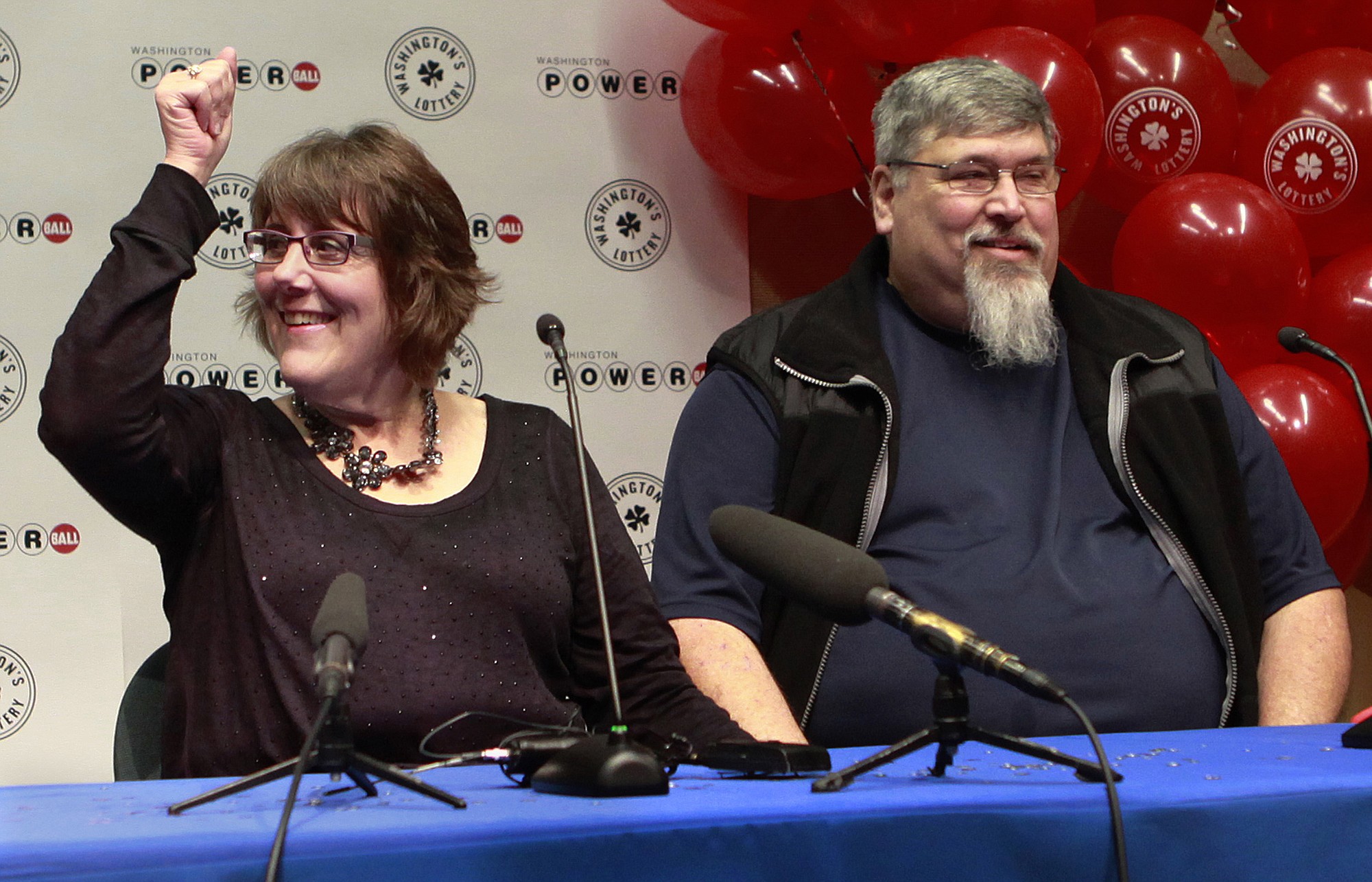 Lisa N. and Everett Quam of Auburn address a Thursday press conference at the Washington State Lottery headquarters in Olympia after selecting the winner numbers in the $90 million Powerball jackpot over the weekend.