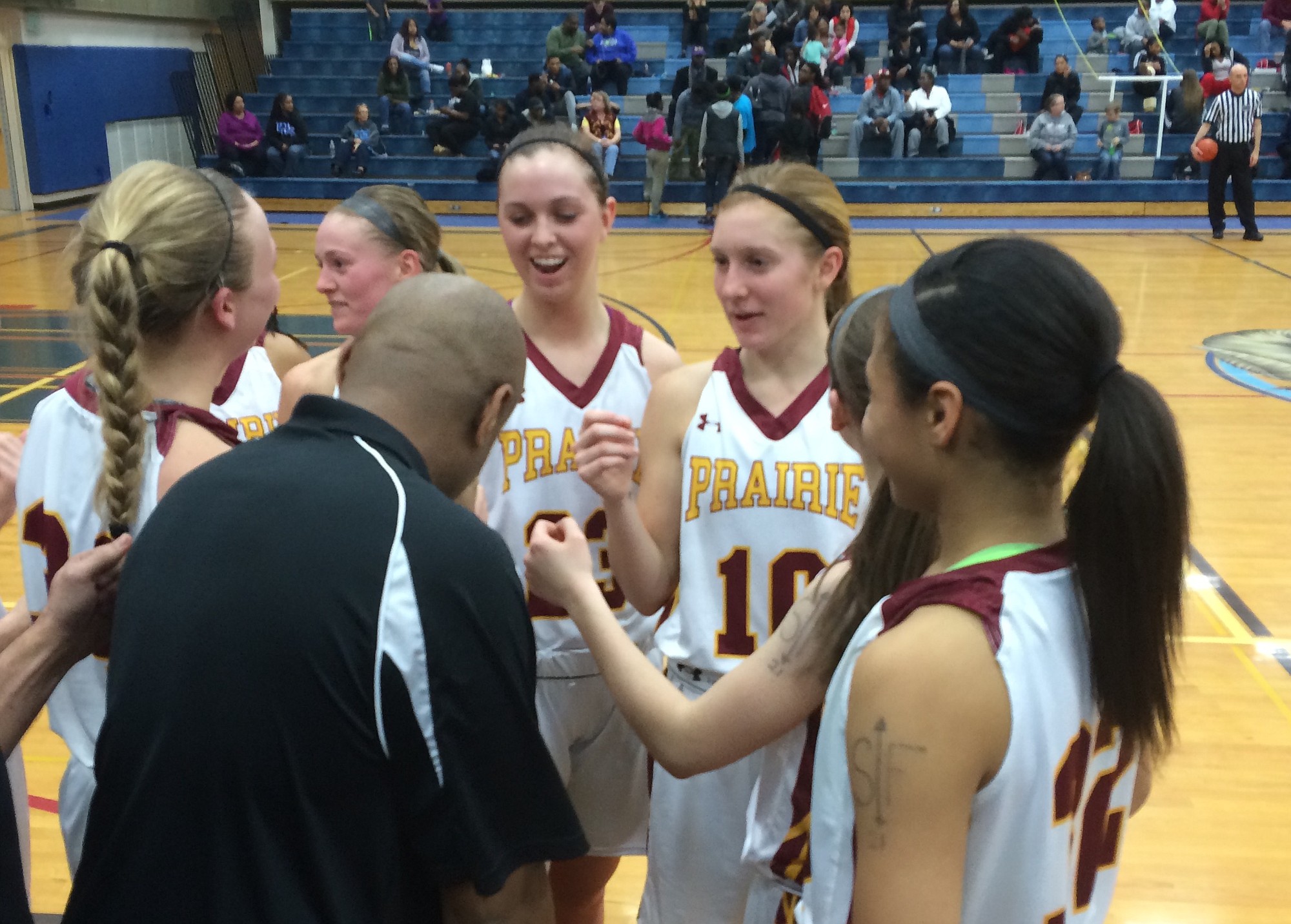 The Prairie girls basketball team huddles during its 3A bi-district playoff game against Lakes on Friday in Puyallup.