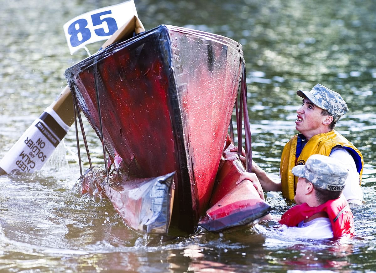Participation in Longview's annual Cardboard Boat Regatta on Wednesday was brief for these two members of the Washington National Guard, who abandoned ship shortly after the start of the Procrastinator's Cup, a race limited to boats built entirely on the day of the event.