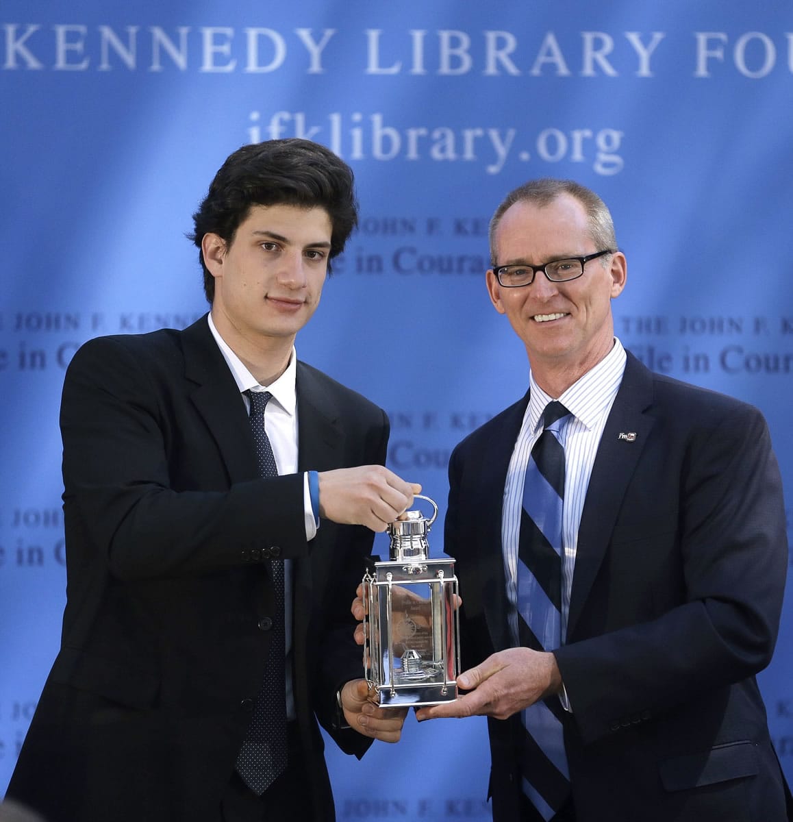 Jack Schlossberg, left, grandson of President John F. Kennedy, presents former U.S. Rep. Bob Inglis, R-S.C., with the 2015 Profile in Courage Award on Sunday at the John F. Kennedy Library and Museum in Boston.