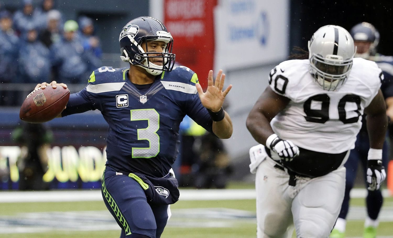 Seattle Seahawks quarterback Russell Wilson (3), is chased by Oakland Raiders' Pat Sims, acknowledged he did not play well at all in Sunday's game.