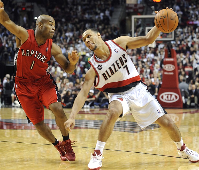 Toronto's Jarrett Jack (1) defends a drive by Portland's Brandon Roy (7) during the second half of Saturday's game at the Rose Garden. Roy had a team-high 26 points as the Trail Blazers beat the Raptors 97-84.