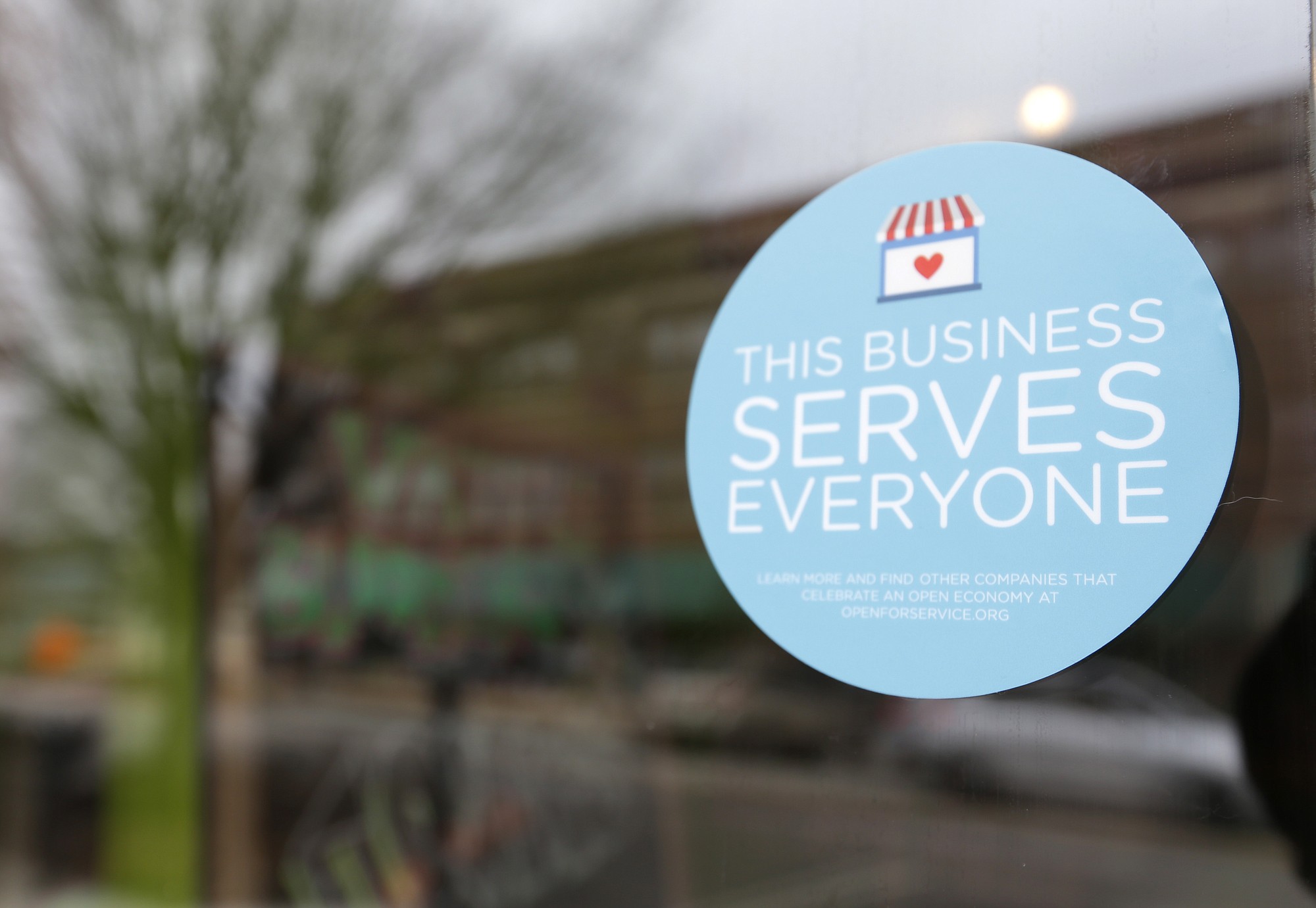 A window sticker on a downtown Indianapolis business Wednesday shows its objection to the Religious Freedom bill passed by the Indiana legislature.