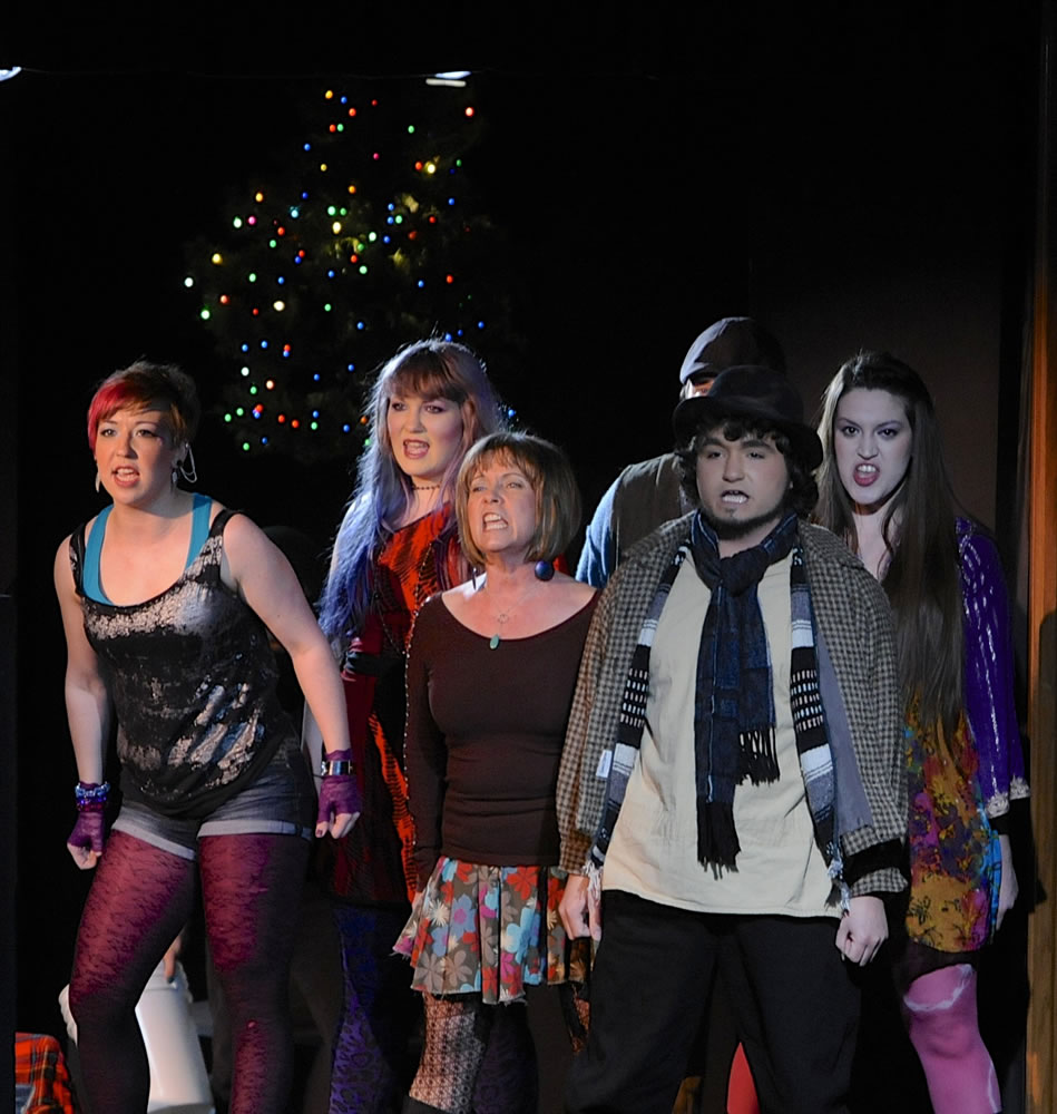 Members of the ensemble including, Linda Owsley, center, and Richard Traver, right, during a performance of &quot;Rent&quot; at the Decker Theatre in Clark College's Frost Arts Center in Vancouver.