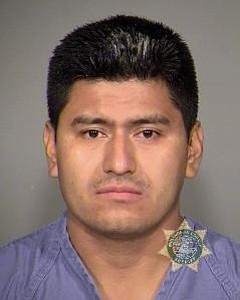 Edy Porfirio Reynoso-Ramirez is suspected of driving the vehicle that ran into a motorcycle on Marine Drive in Portland on Monday.