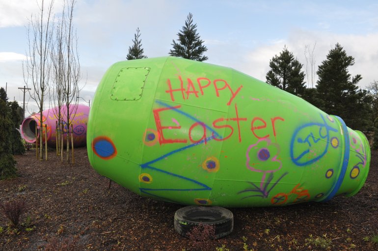Cement truck cylinders painted as Easter eggs were mysteriously left in the Ridgefield roundabout Thursday.