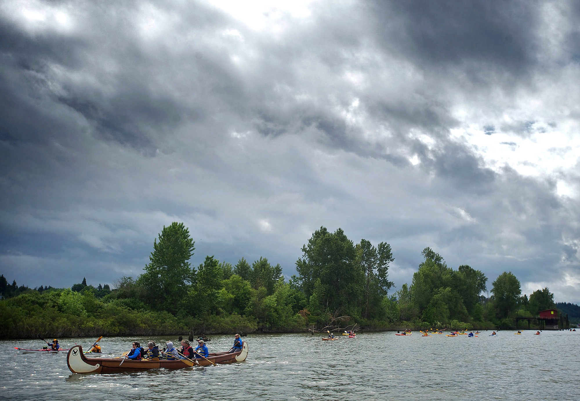 Dignitaries and members of the public paddle down Lake River to the Columbia River in 2012 during the Big Paddle event, which allowed them to learn about historical, cultural and environmental sites along the way.