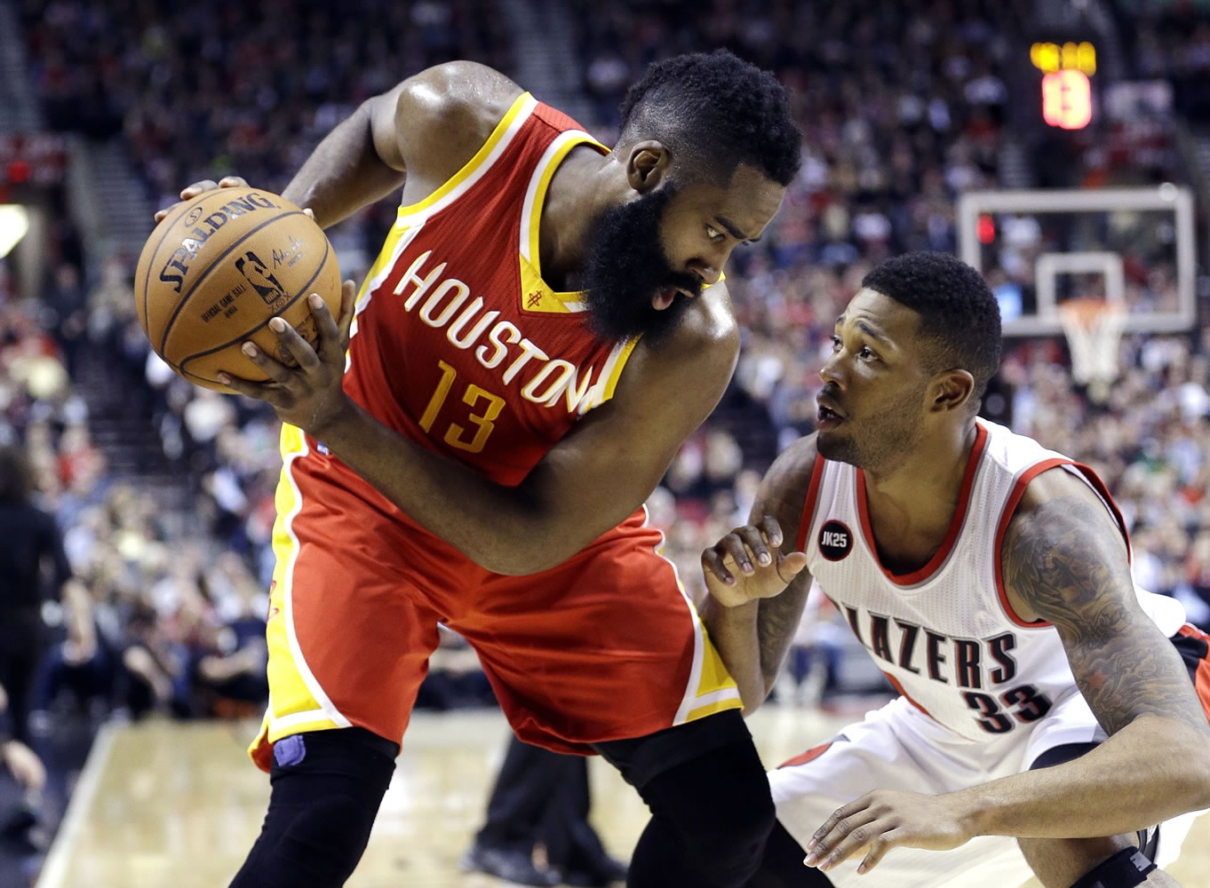 don ryan/Associated Press
Portland's Alonzo Gee, right, plays tight defense against Houston Rockets guard James Harden.