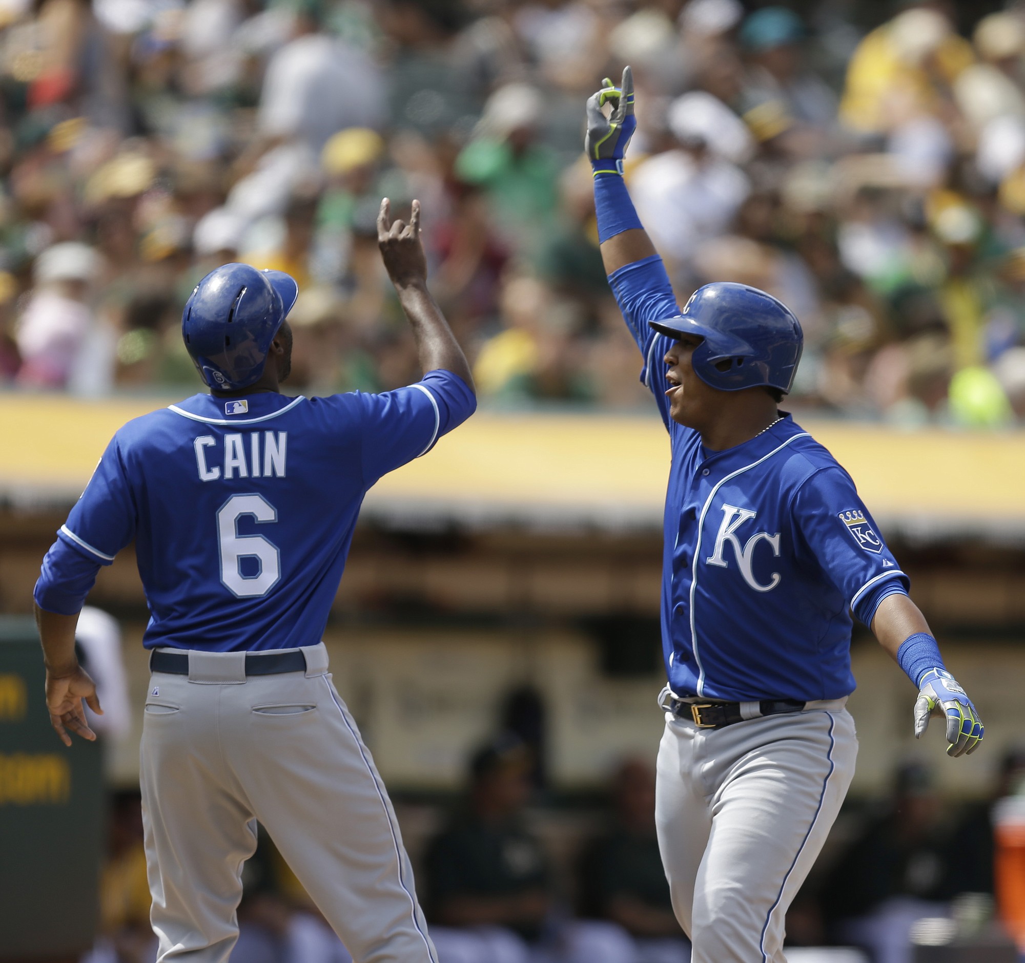 Kansas City Royals' Salvador Perez, right, and Lorenzo Cain are two of the four Royals players voted in as starters for the 2015 All-Star Game.
