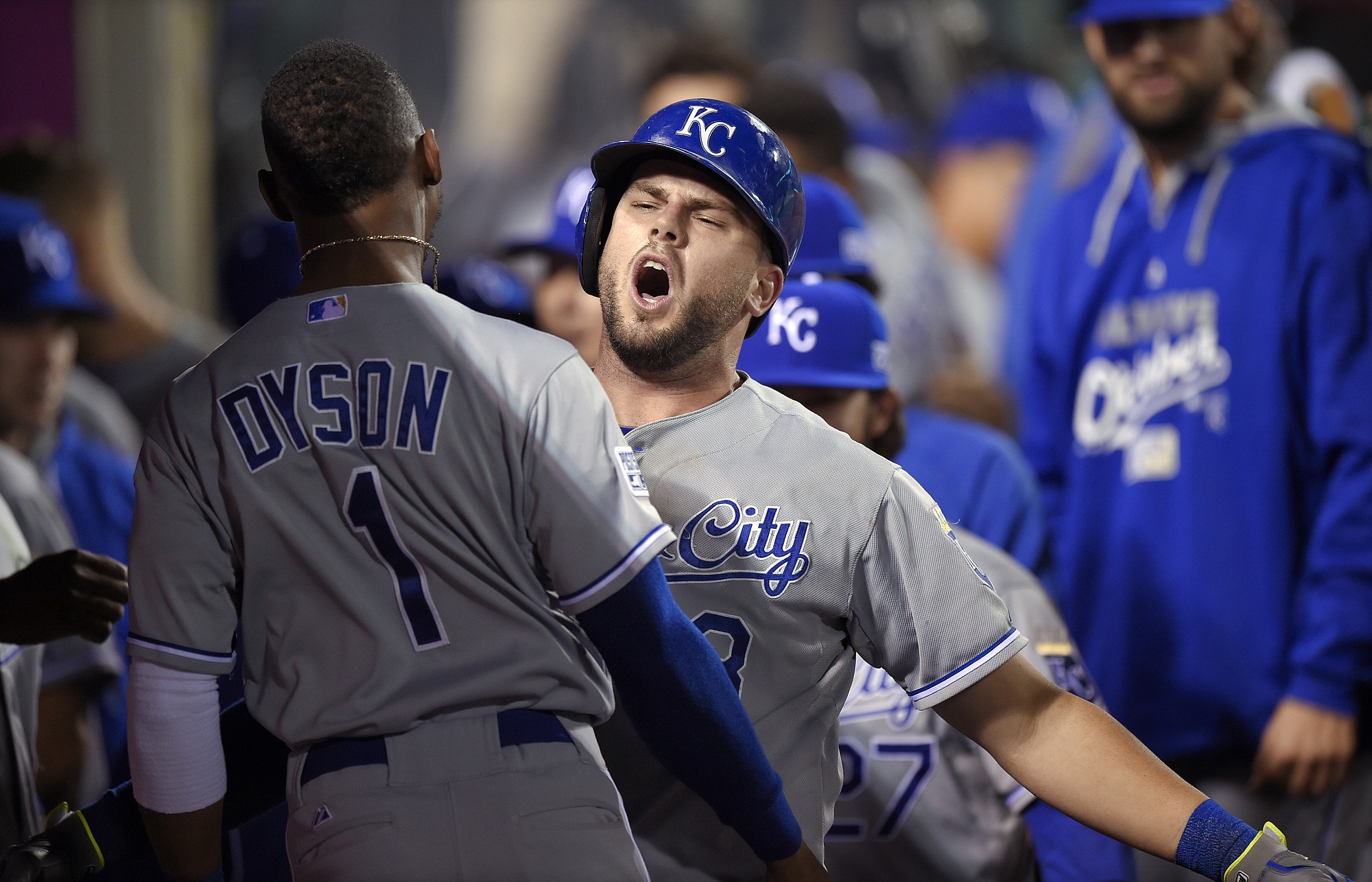 Kansas City Royals' Mike Moustakas celebrates his home run with Jarrod Dyson, during the 11th inning against the Los Angeles Angels in Game 1 of the AL Division Series in Anaheim, Calif., Thursday, Oct. 2, 2014. (AP Photo/Mark J.