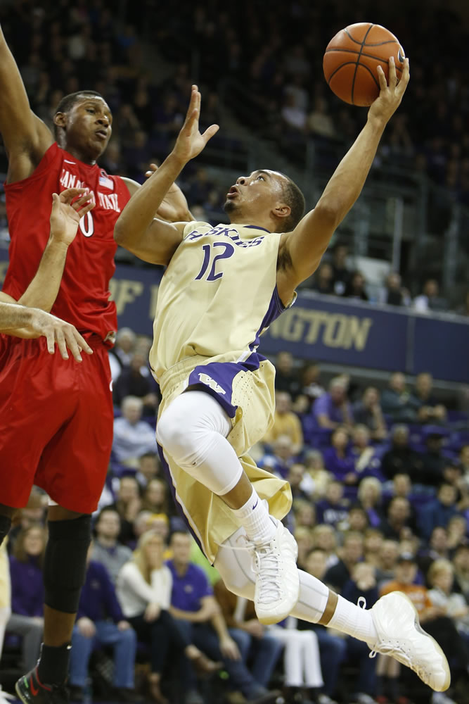 Washington guard Andrew Andrews (12) goes up for a basket against San Diego State forward Skylar Spencer (0) in the first half Sunday, Dec. 7, 2014, in Seattle.