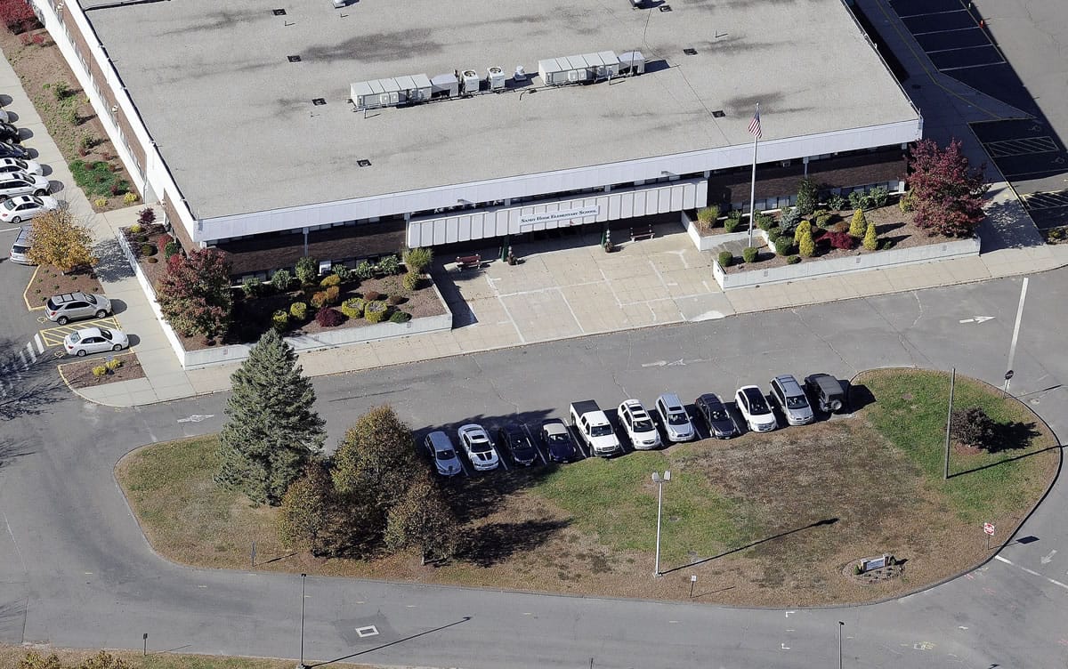 This Oct. 28, 2013, aerial photo shows Sandy Hook Elementary School, relocated to the former Chaulk Hill School building in Monroe, Conn., after the original building in neighboring Newtown was razed following the Dec.