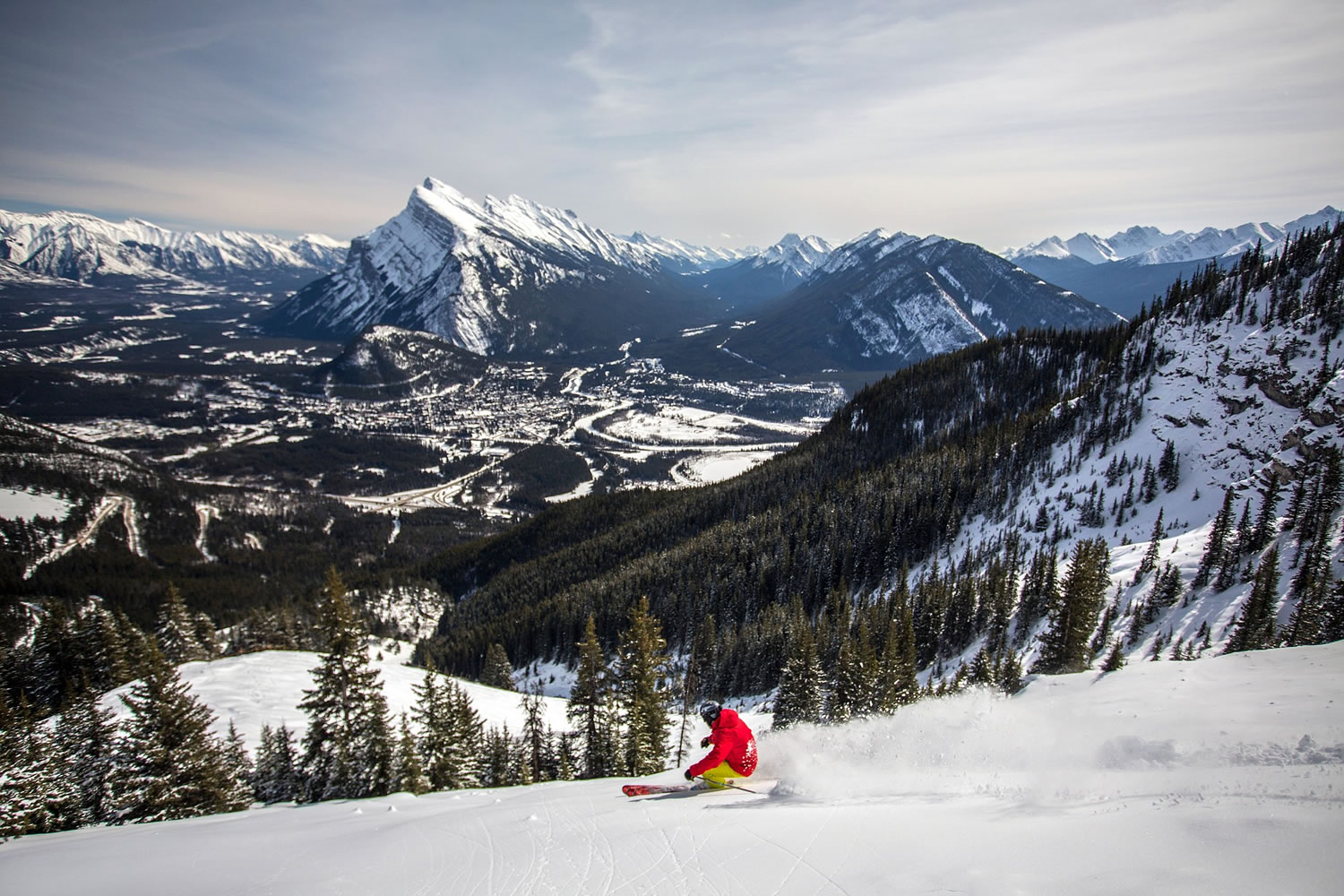 A snowboarder on the mountain in the Canadian Rockies, just 15 minutes from the town of Banff, Alberta. It?s one of a number of small resorts located near larger, big-name resorts.