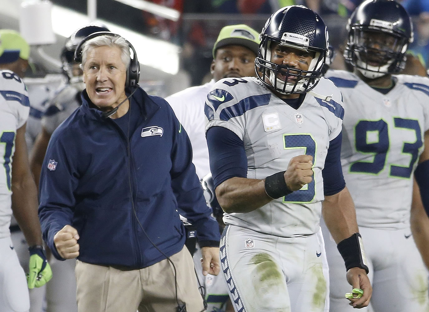 Seattle Seahawks head coach Pete Carroll, left, and quarterback Russell Wilson (3) celebrate during the fourth quarter of an NFL football game against the San Francisco 49ers in Santa Clara, Calif., Thursday, Nov. 27, 2014.