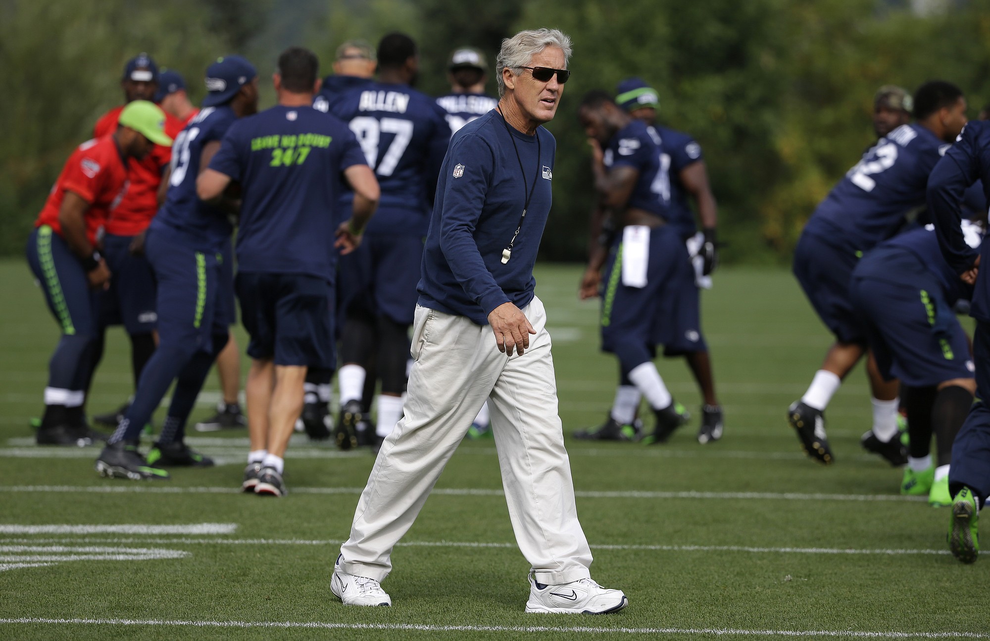 Seattle Seahawks head coach Pete Carroll walks on the field during 2015 training camp. (AP Photo/Ted S.