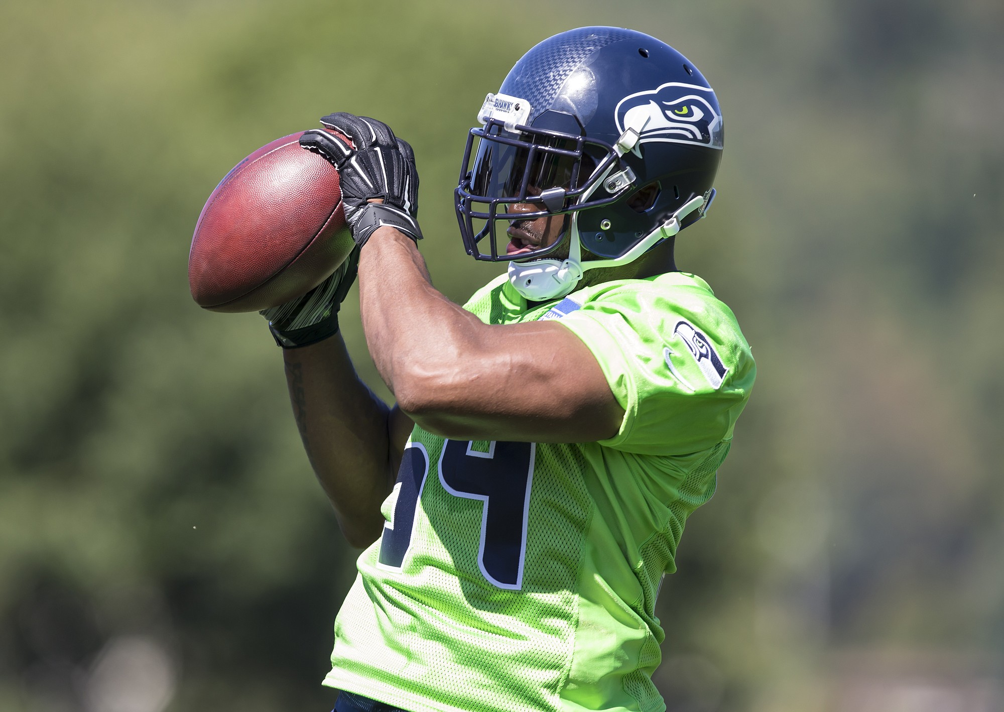 Seattle Seahawks linebacker Bobby Wagner catches a ball in drills during the first day of training camp on Friday, July 31, 2015, in Renton.