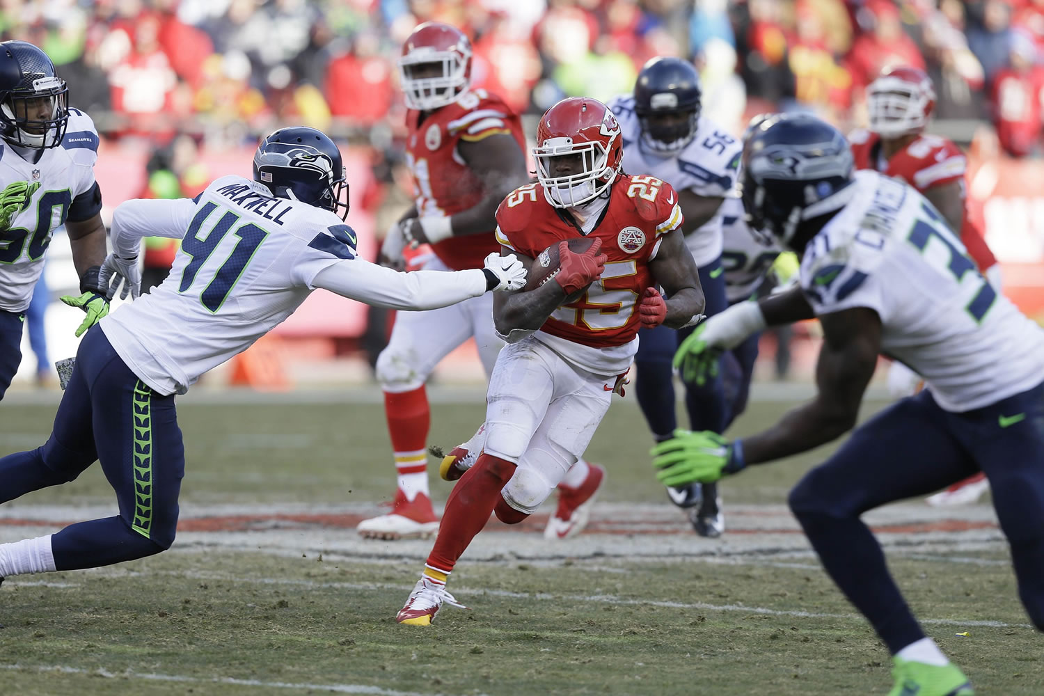 Kansas City Chiefs running back Jamaal Charles (25) carries the ball past Seattle Seahawks cornerback Byron Maxwell (41) in the second half Sunday, Nov. 16, 2014. Charles rushed for 159 yards and two touchdowns in the Chiefs' 24-20 win.