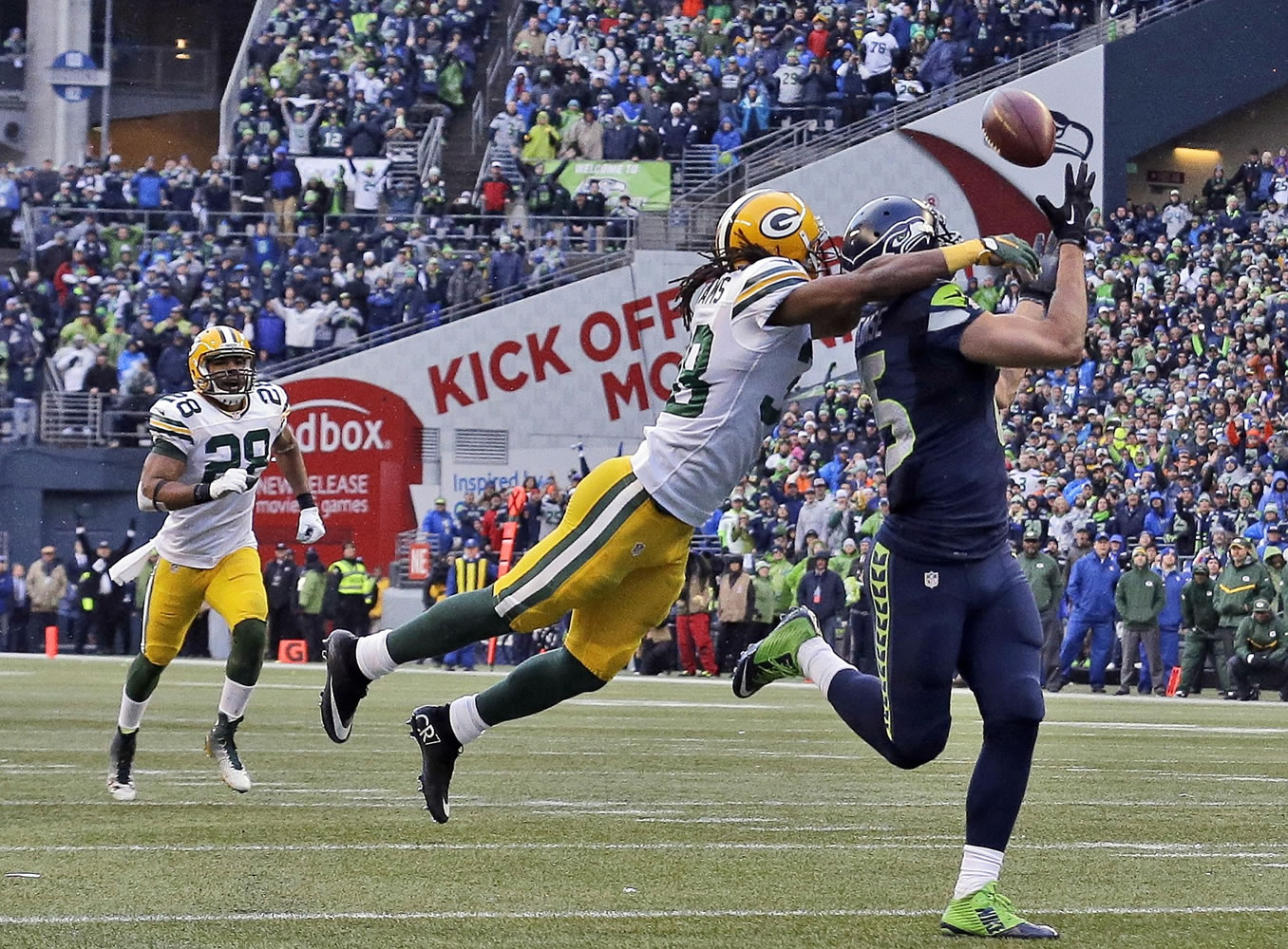 Seattle Seahawks' Jermaine Kearse, right, catches the game-winning touchdown pass during overtime of the NFC championship NFL football game against the Green Bay Packers in Seattle.