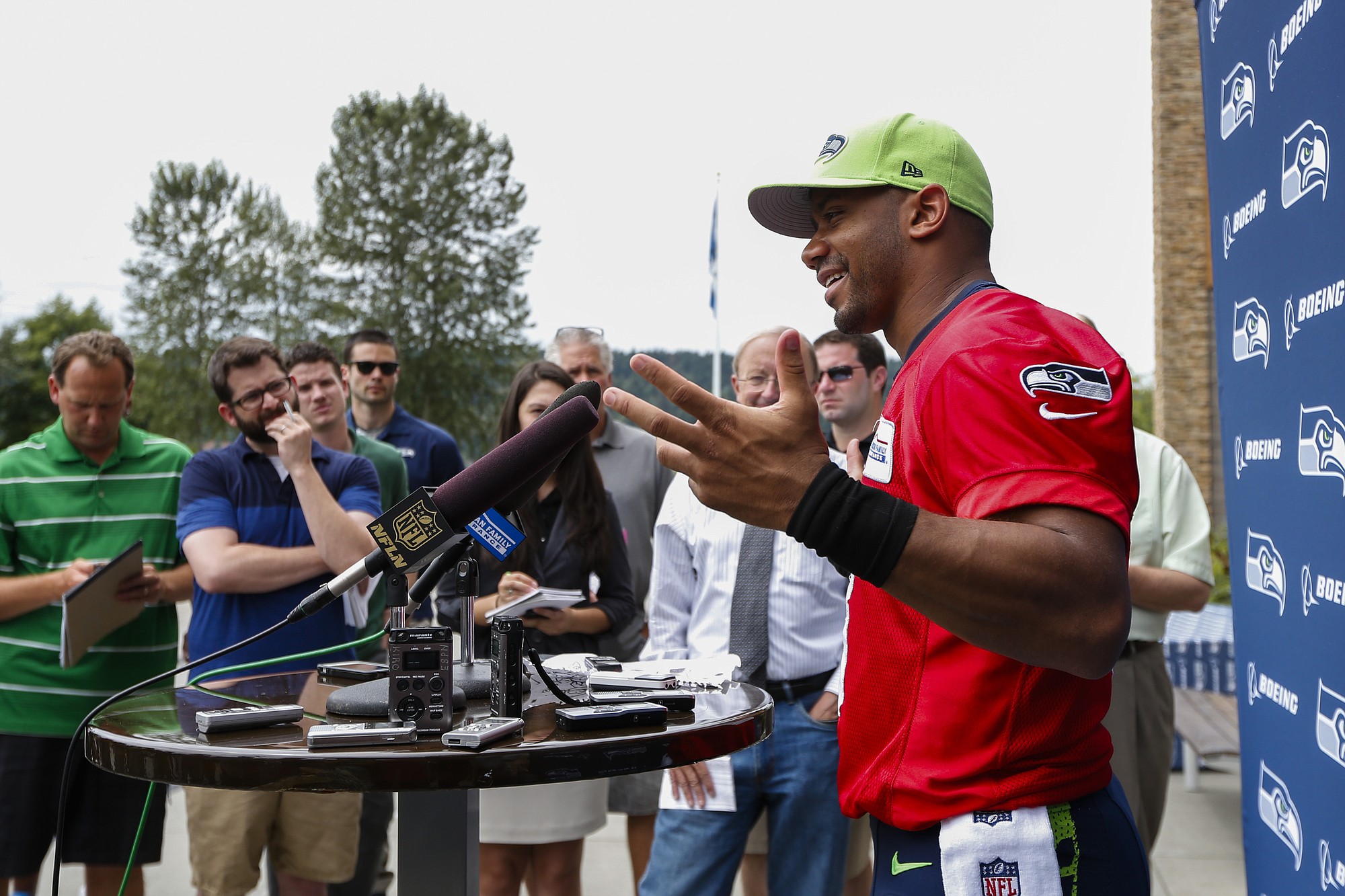 Seattle Seahawks quarterback Russell Wilson answers questions during a press conference following the conclusion of minicamp Thursday, June 18, 2015, in Renton.
