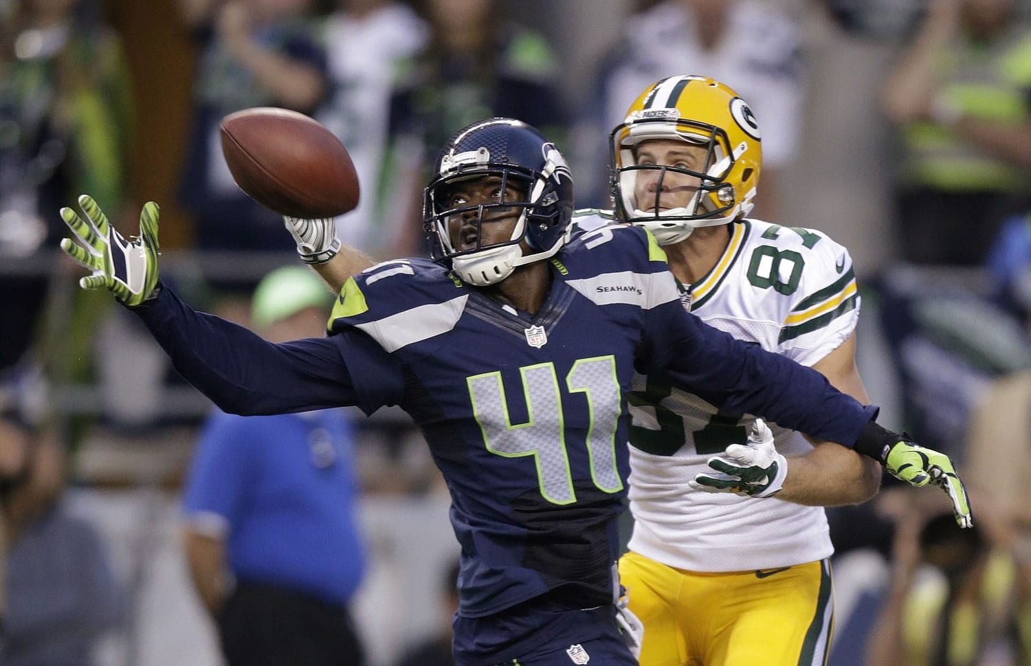 Seattle Seahawks cornerback Byron Maxwell (41) breaks up a pass intended for Green Bay Packers wide receiver Jordy Nelson (87) during the game on Thursday, Sept. 4, 2014, in Seattle.