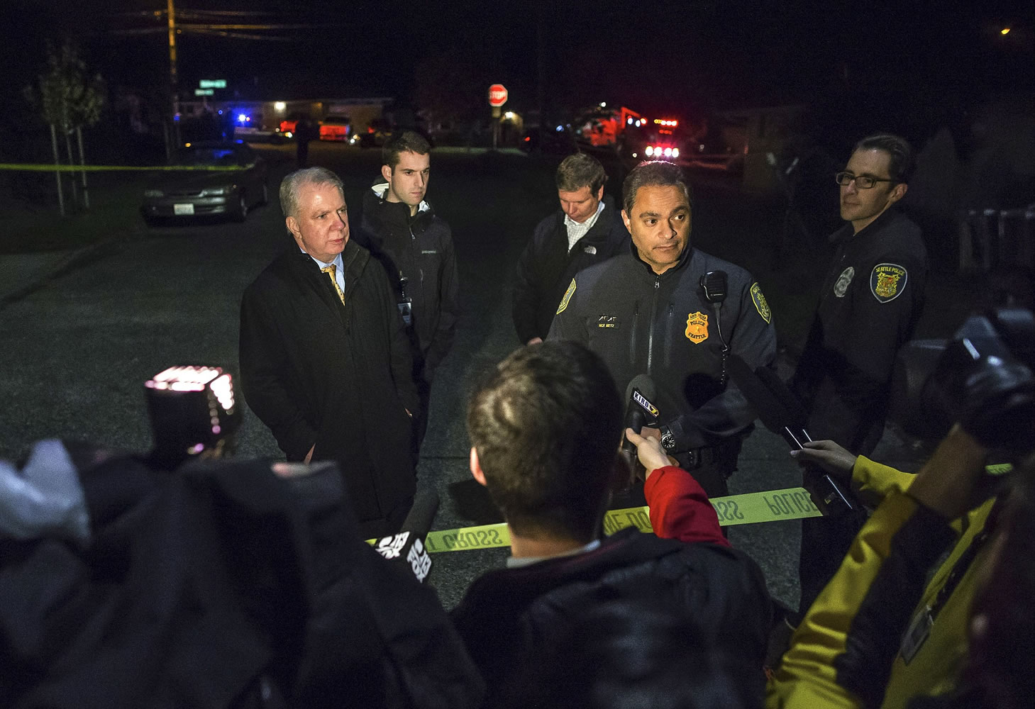 Assistant Police Chief Nick Metz and Seattle Mayor Ed Murray talk to reporters regarding a murder/suicide in south Seattle on Monday. Seattle police said a man fatally shot his adult daughter and a teenage granddaughter on Monday night at a south Seattle home, then killed himself.