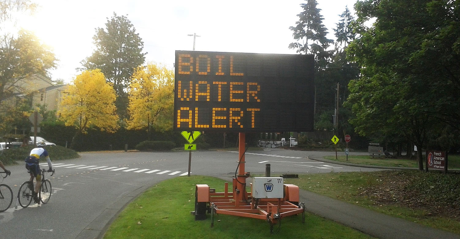 A sign in the Seattle suburb of Mercer Island on Saturday cautions residents to boil water before drinking it. On Monday, Mercer Island water samples tested clean of E.