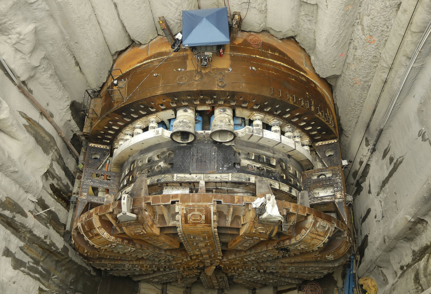 The inner workings of the cutting head of Bertha are shown at the bottom of a 120-foot access pit after a 270- ton section of the front shield was removed.