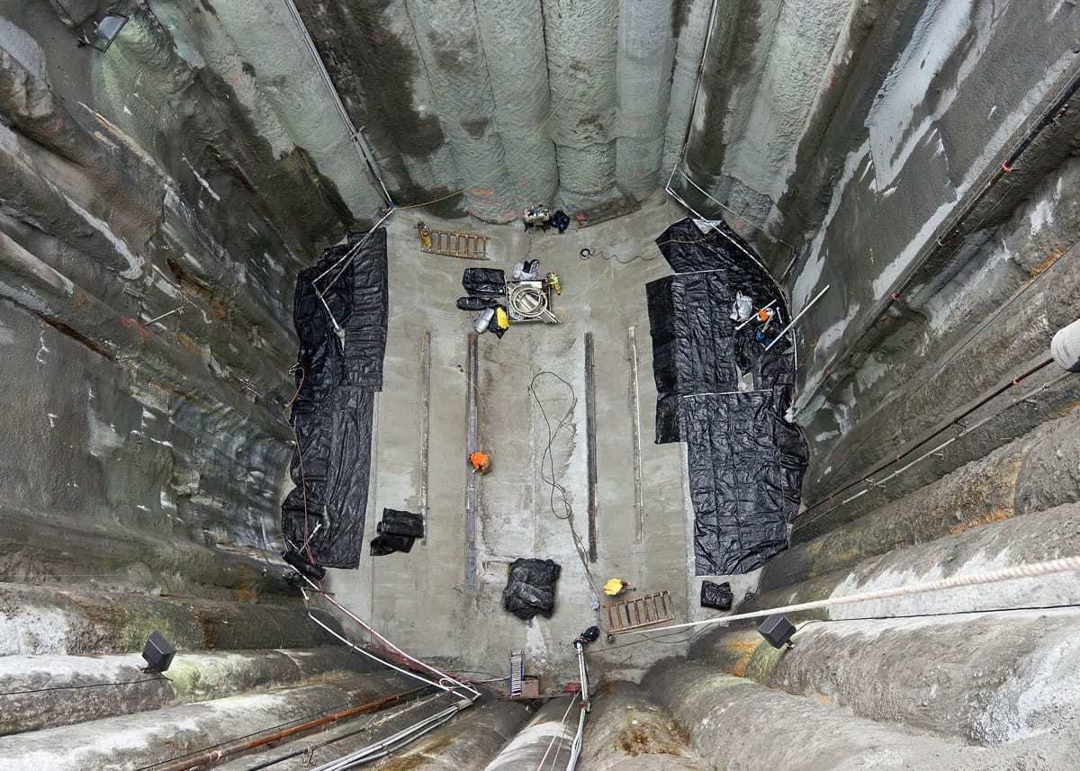 This Feb. 9, 2015 photo provided by the Washington State Department of Transportation, shows the concrete floor of a pit dug to repair the stalled tunnel boring machine known as Bertha in Seattle. Bertha will have to drill about 20 feet through the pit's concrete wall so its 2,000-ton front head can be lifted by a crane to the surface.