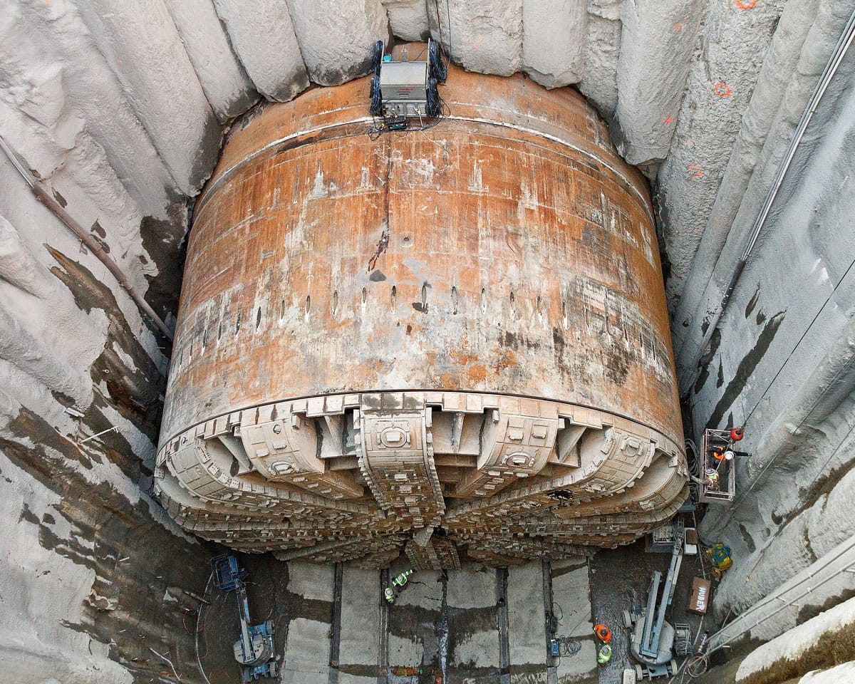 The massive tunnel-boring machine called Bertha sits at the bottom of a rescue pit Wednesday in Seattle. The machine is now in position to be torn apart so it can be repaired.