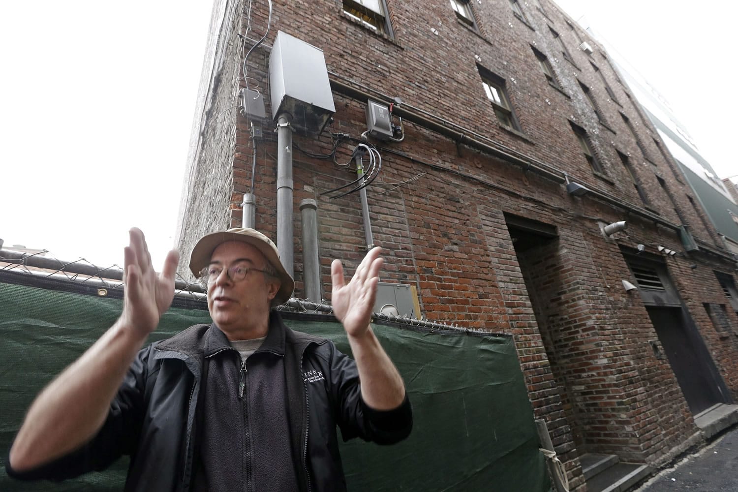 OK Hotel tenant Cyrus Charters talks about how he thinks the building behind him is settling on its southeast corner in Seattle's Pioneer Square district, where the Alaskan Way Viaduct stands nearby.