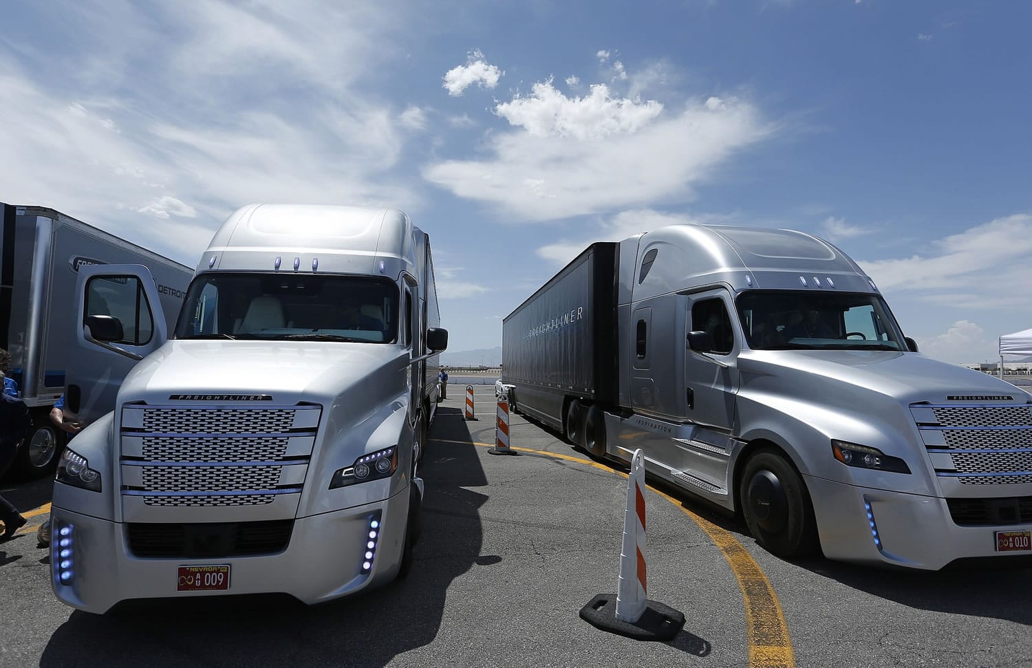 People load into a Daimler Freightliner Inspiration self-driving truck for a demonstration Wednesday in Las Vegas.