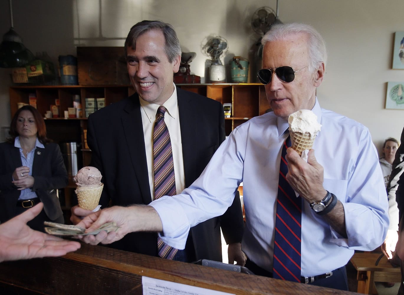 Vice President Joe Biden, right, pays for ice cream cones at Salt &amp; Straw for himself and U.S. Sen. Jeff Merkley after a campaign rally Wednesday in Portland.