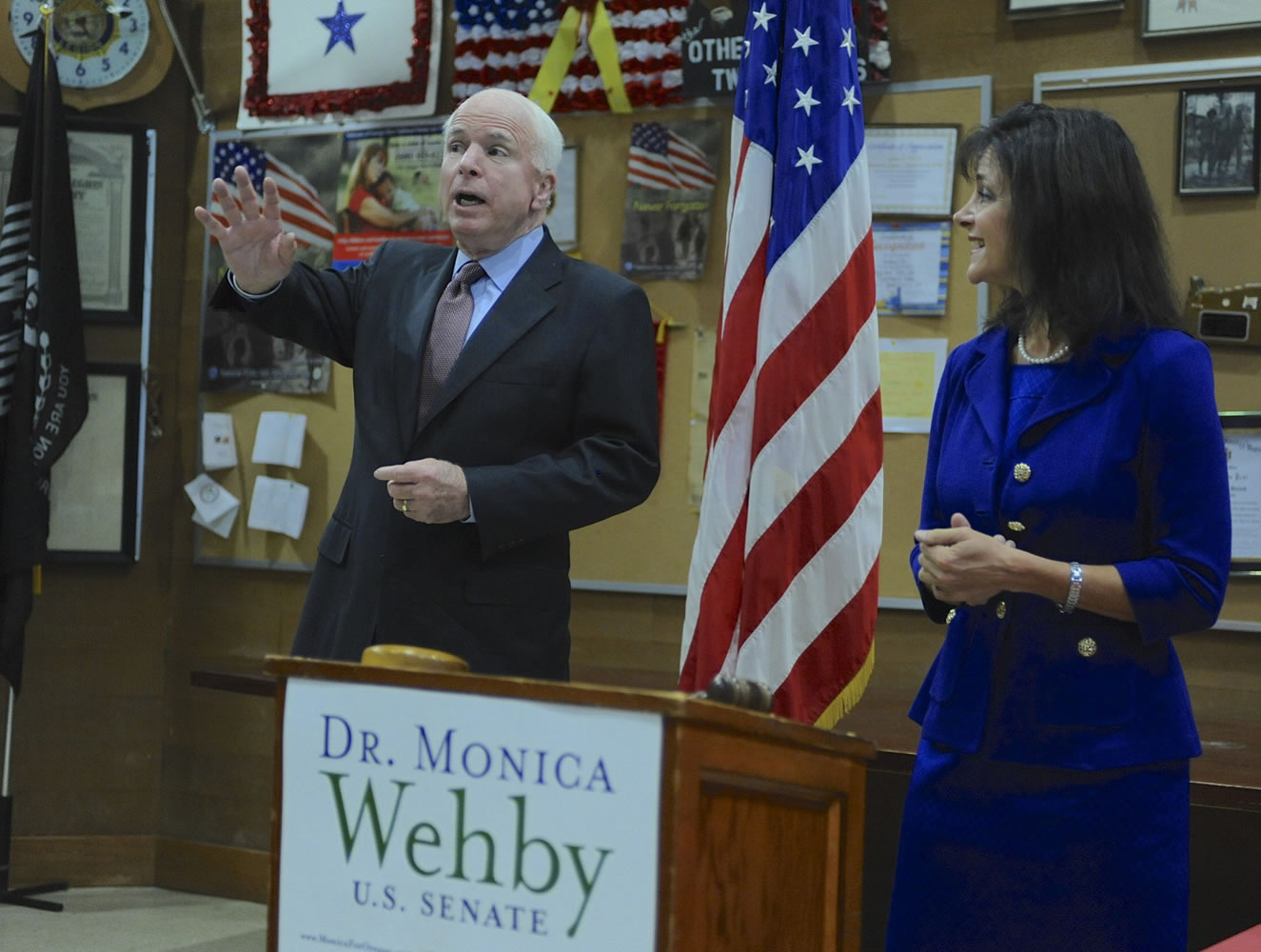 Oregon Republican Senate candidate Monica Wehby, right, listens as Arizona Sen.