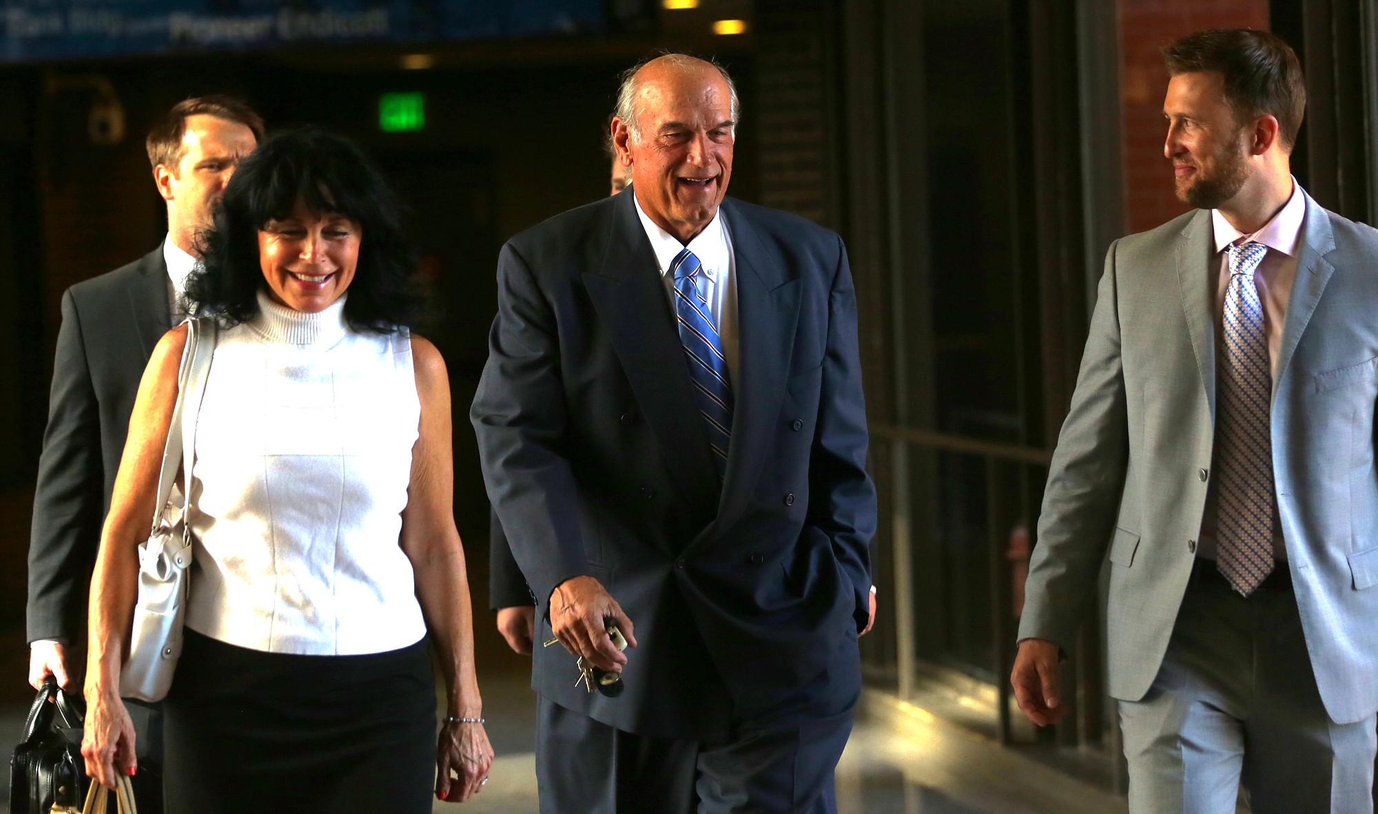 Former Minnesota Gov. Jesse Ventura, center, arrives at court with his wife, Terry, and others for his defamation lawsuit against &quot;American Sniper&quot; author Chris Kyle in St.