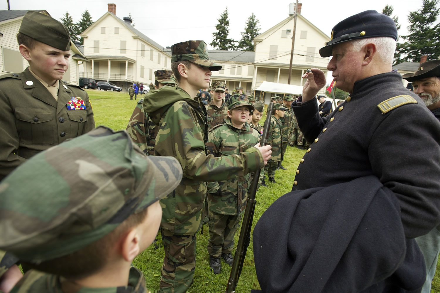 1st Oregon Volunteer Infantry reenactor Mitch Rice talks with Lewis and Clark Young Marines during a soldiers bivouac demonstration at the Vancouver Barracks, Monday, May 27, 2013.