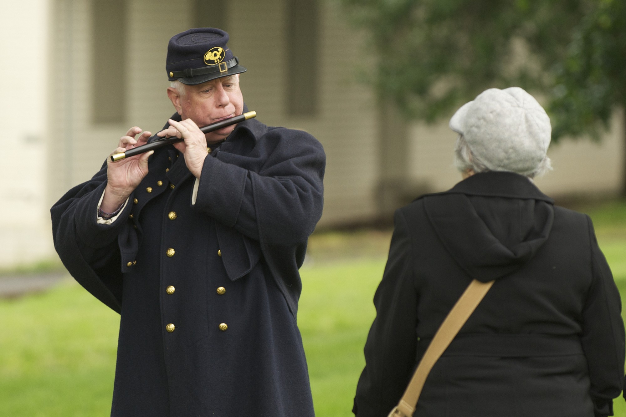 1st Oregon Volunteer Infantry reenactor Mitch Rice plays the fife for visitors during a soldiers bivouac demonstration at the Vancouver Barracks, Monday, May 27, 2013.