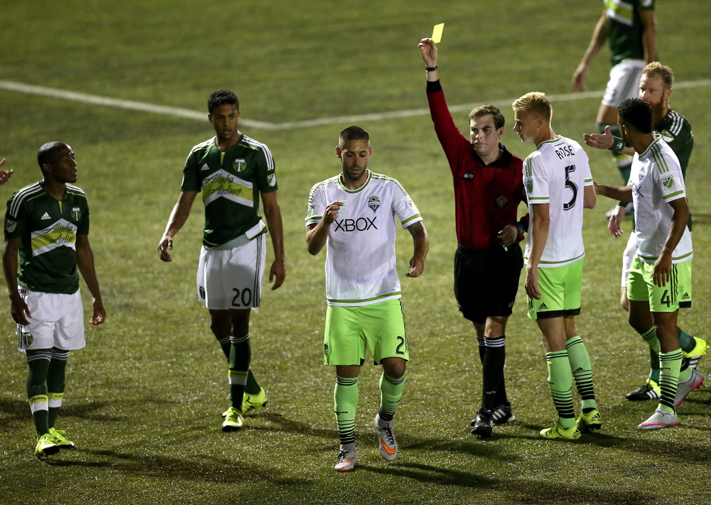 Seattle Sounders FC's forward Clint Dempsey (2) appears to rip up referee Daniel Radford's notebook after Radford issued a red card to teammate Michael Ariza while playing the Portland Timbers in a U.S. Open Cup soccer match at Starfire Stadium in Tukwila, Wash. Dempsey was issued a red card his actions.