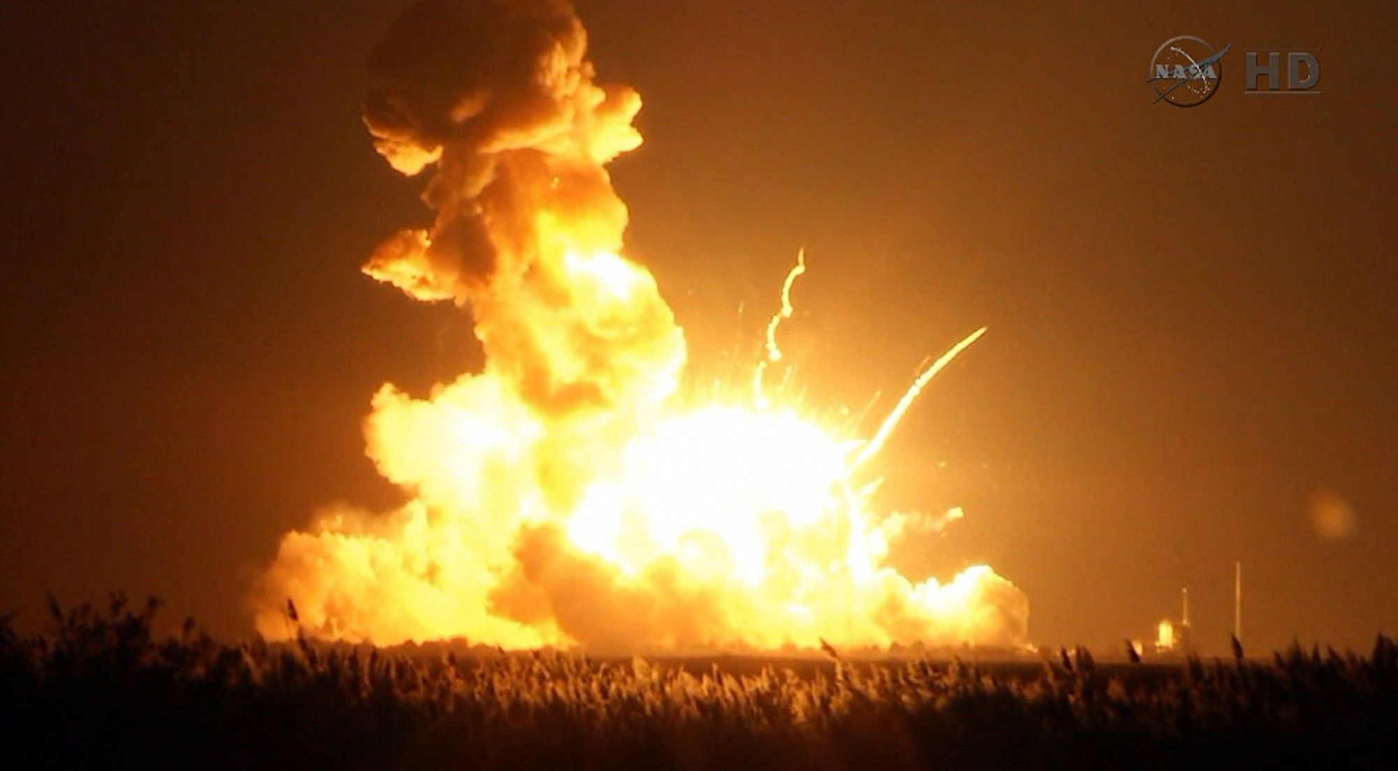Orbital Sciences Corp.'s unmanned rocket blowing up over the launch complex at Wallops Island, Va., just six seconds after liftoff.