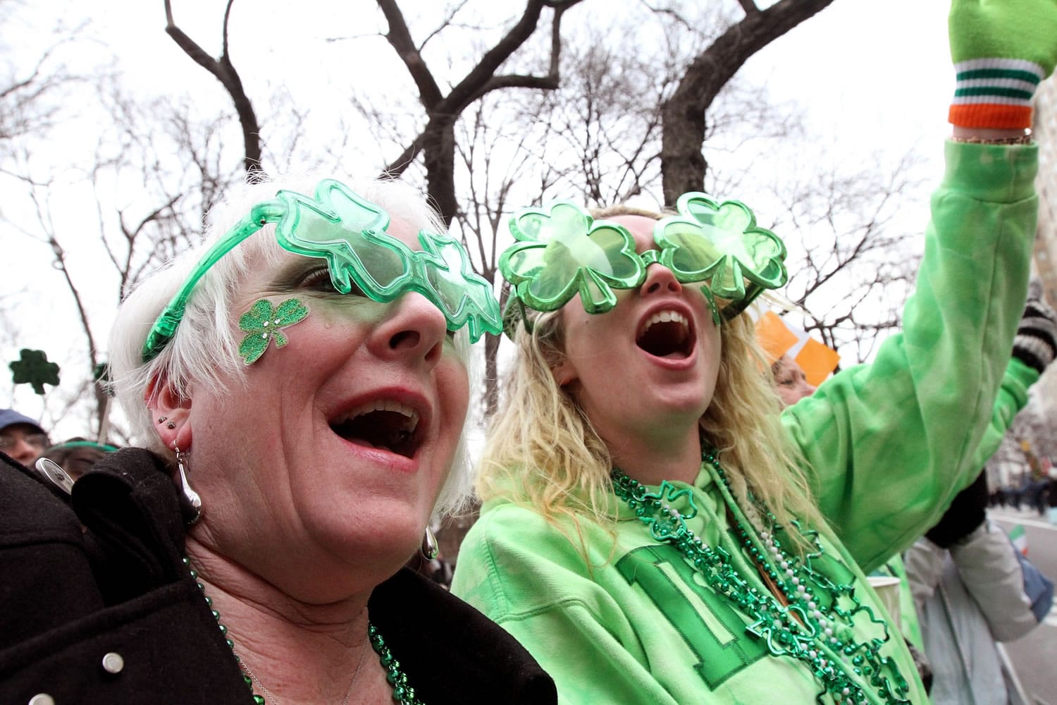 Kathy Brucia, of Bellmore, N.Y, left, and Kara Kerley, of Wantagh, N.Y., laugh Saturday as they watch the St.